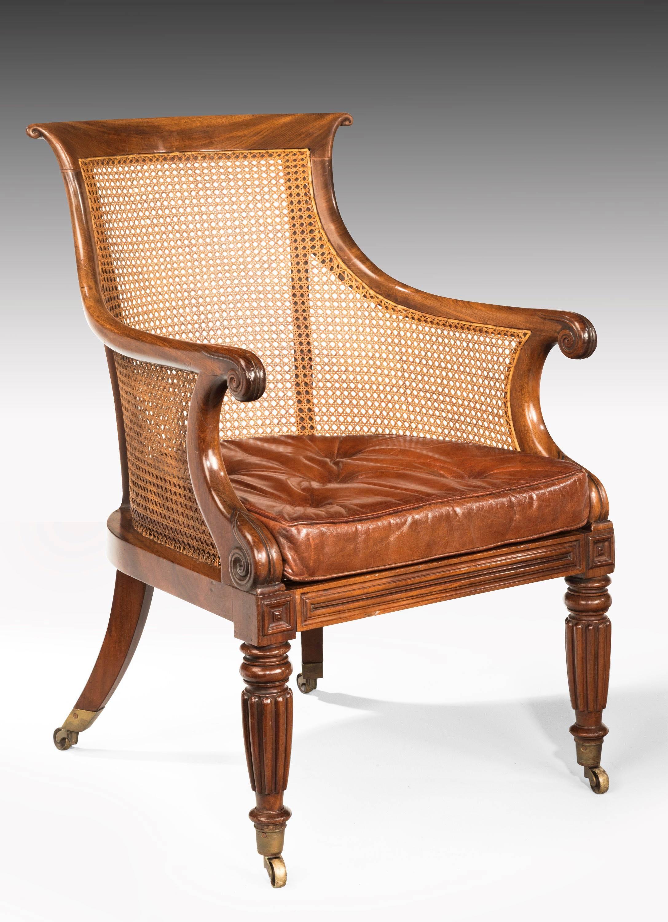 English Pair of Regency Period Bergère Library Chairs with Swept Arms