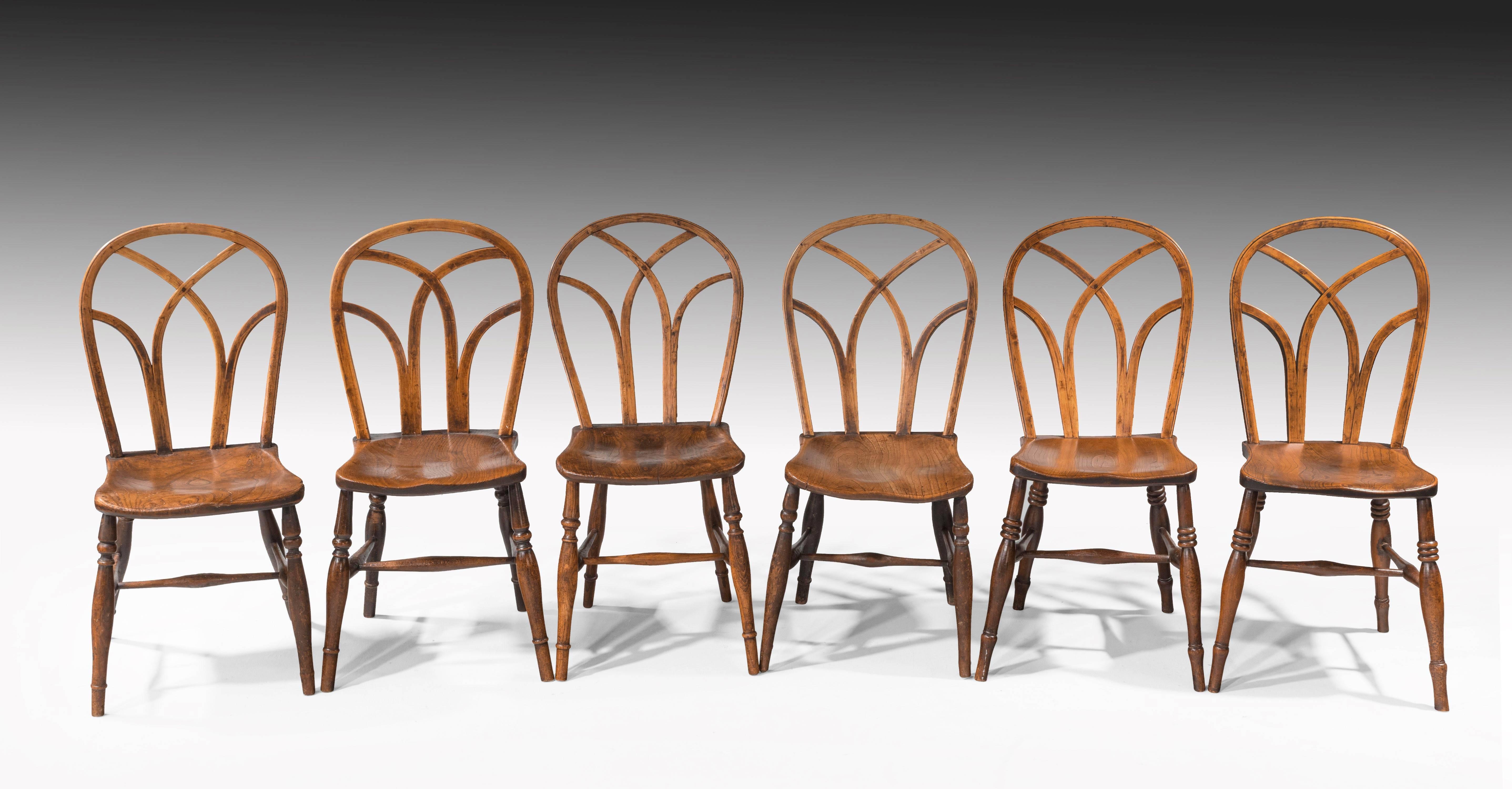 A finely drawn set of eight (six plus two) ash, elm and beech Gothic windsor chairs from Buckinghamshire region of the UK. Particularly elegant lines. Fine original patina.

The single chairs -

Height 35 inches
Width 15.5 inches
Depth 15