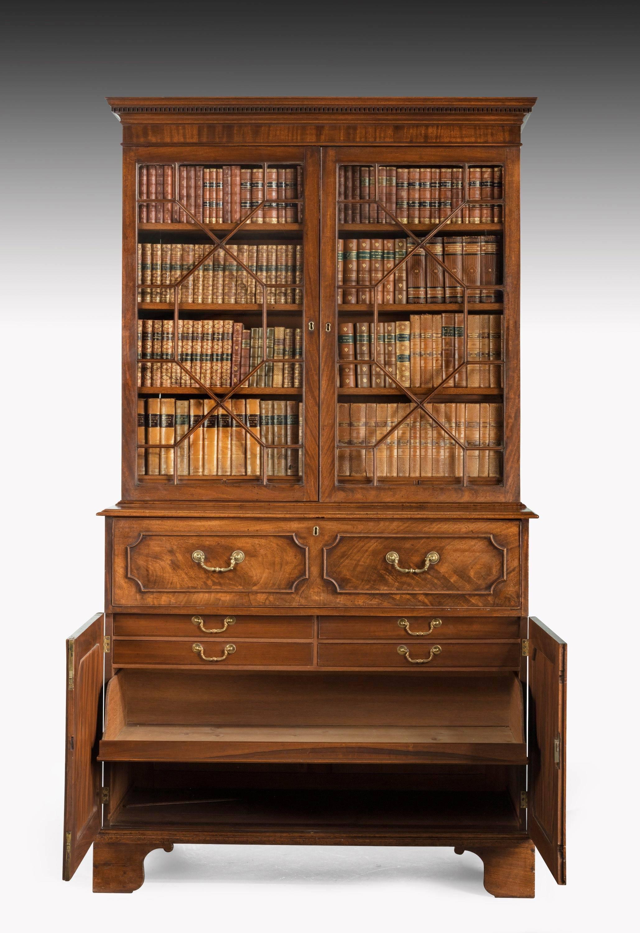 A good George III period mahogany secretaire bookcase attributed to Gillows of Lancaster. The interior finely fitted with Pidgeon holes, drawers and central cupboard. Retaining the original cast gilt bronze swan neck handles. The upper section with