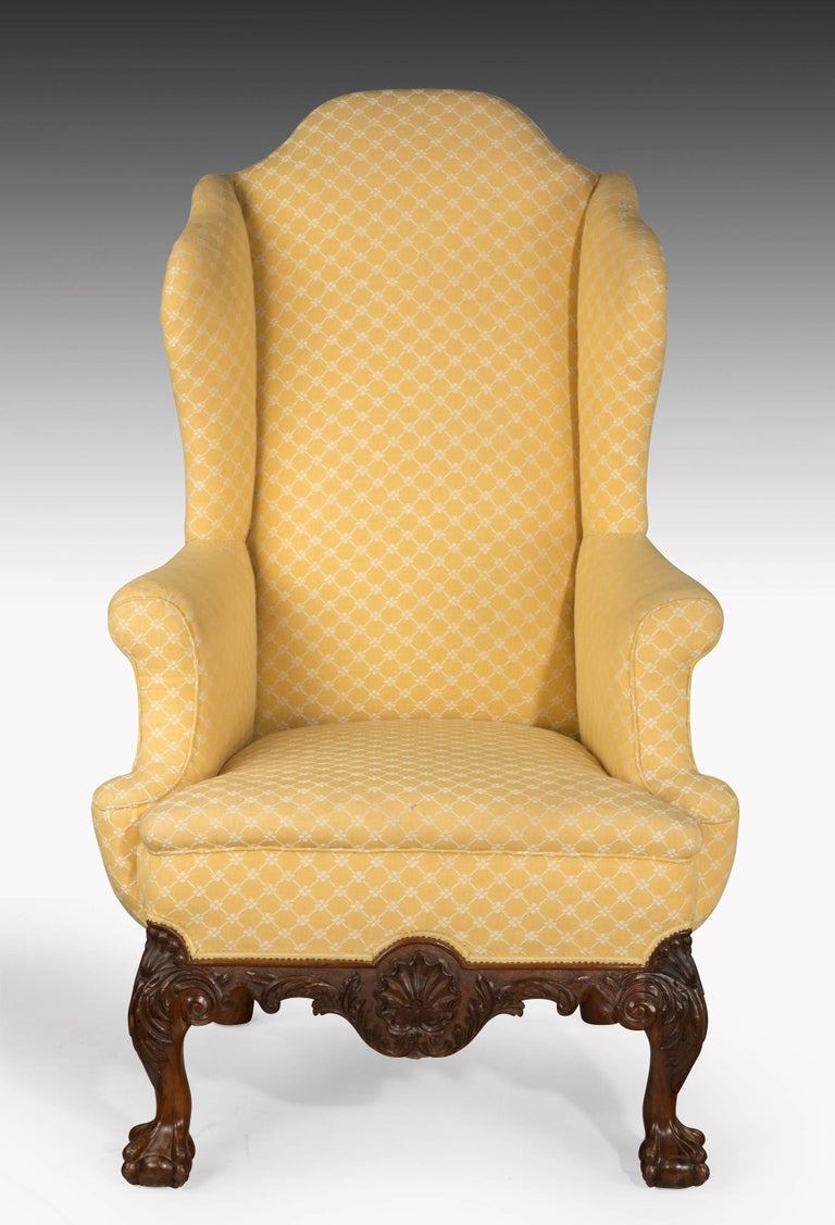 Queen Anne Style Irish Mahogany Framed Wing Chair Terminating in Paw