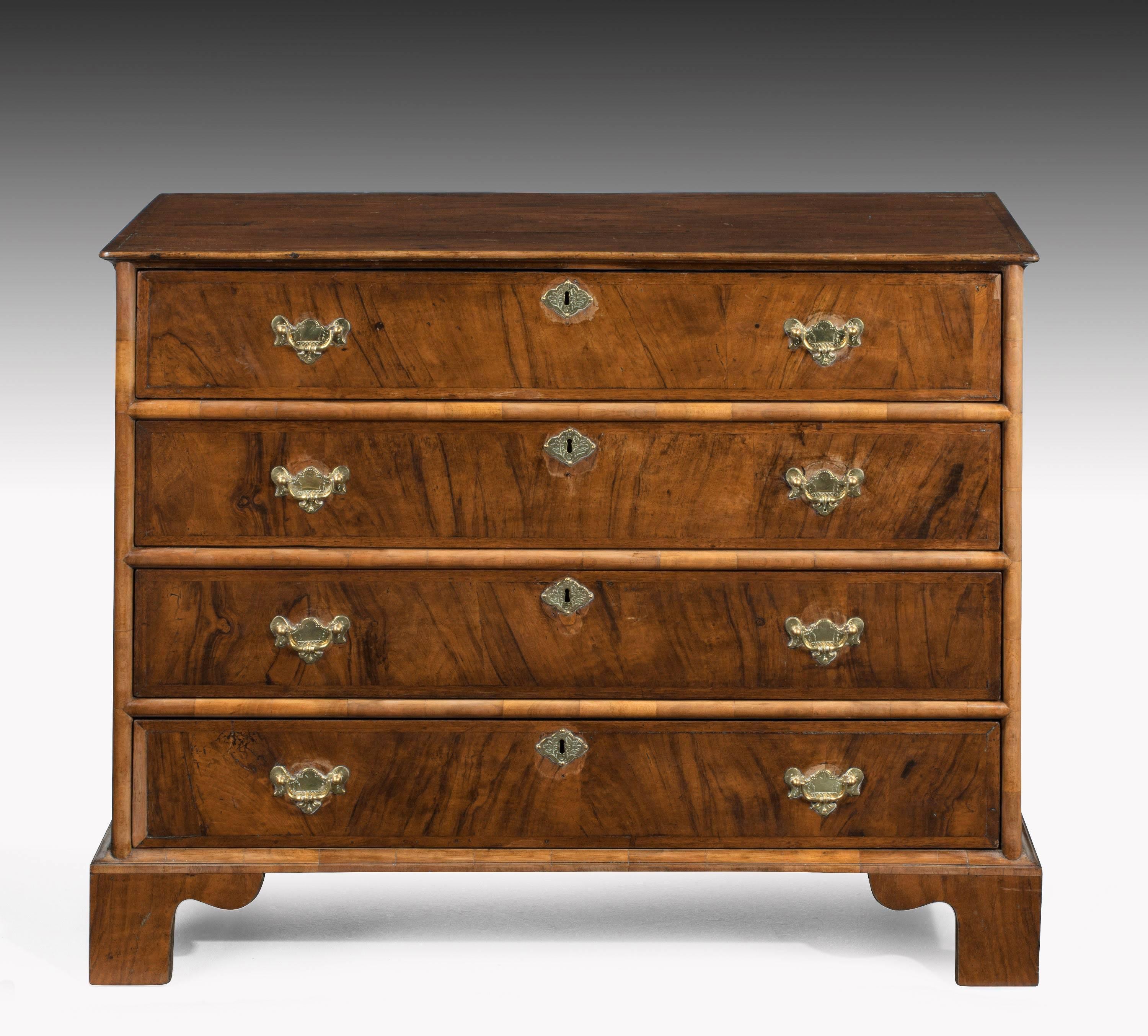 A very well figured mid-18th century chest of four long drawers.