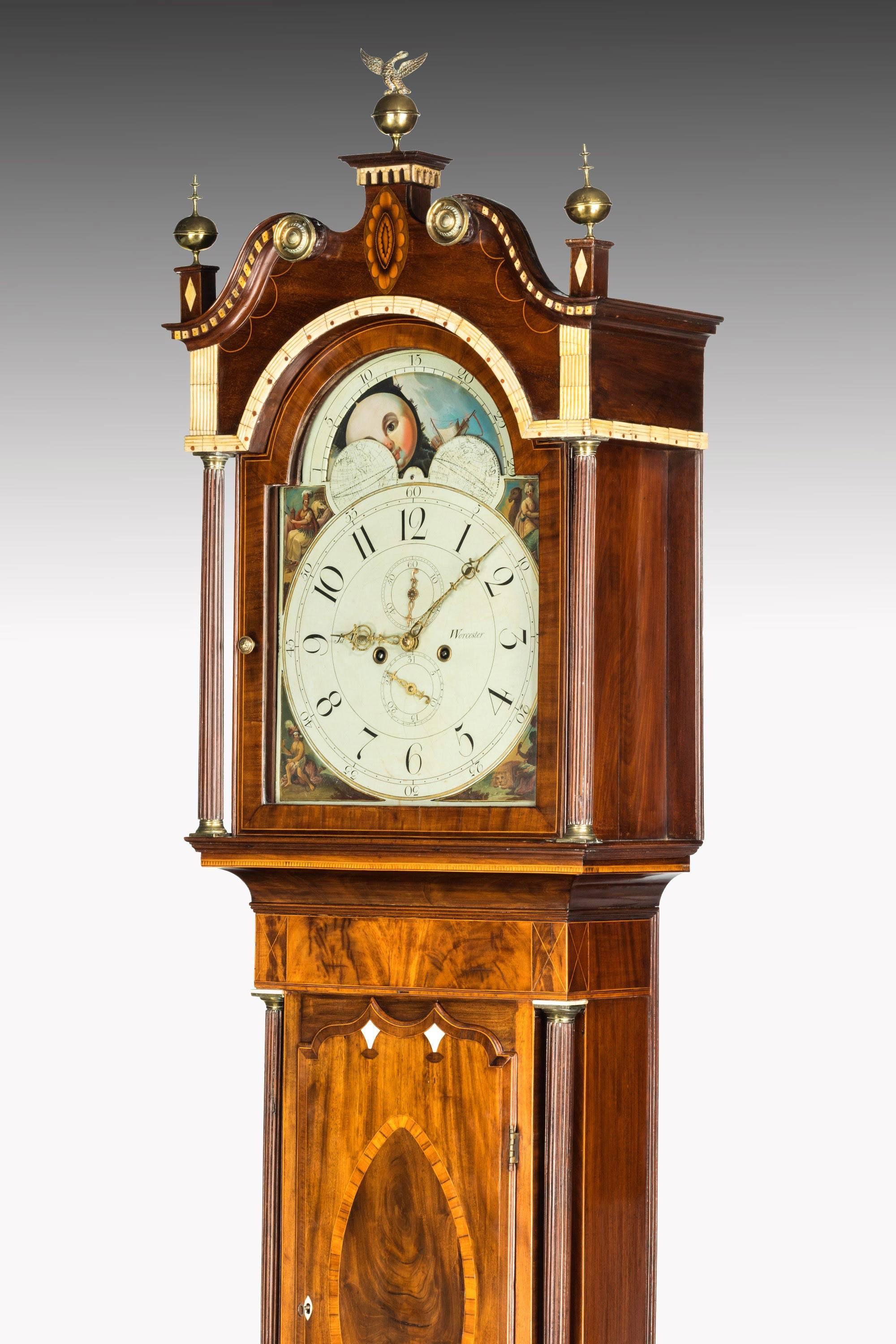 A grand Regency grandfather clock by James Powell of Worcester, watchmaker to the Prince of Wales.

Regency period mahogany crossbanded and ivory and bone inlaid longcase clock by James Powell, Worcester, early 19th century, the hood with brass