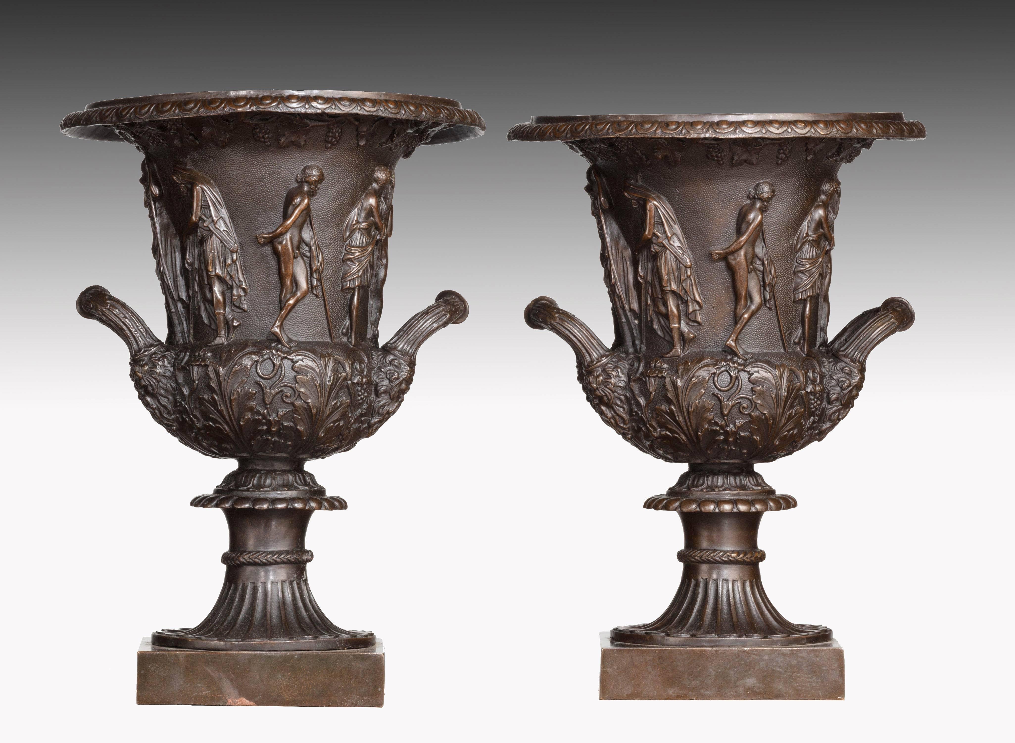 An unusually finely cast and chiselled pair of neoclassical bronze Campana shaped urns. With continuous decoration around the main body. Rich dark brown patina.