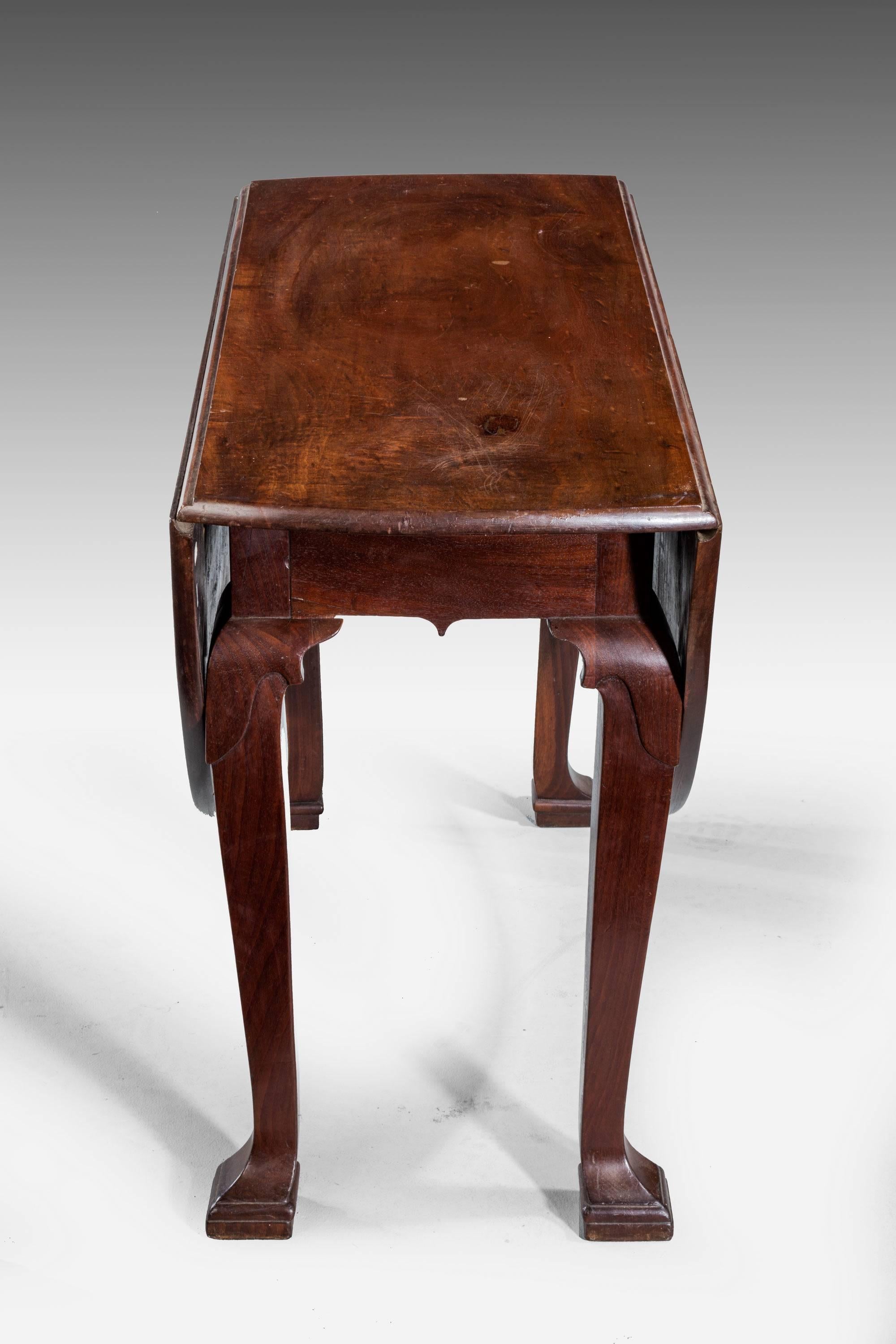 A late 18th century oval drop-leaf table. On unusual square section cabriole supports ending in block toes. Well figured and in excellent overall condition.