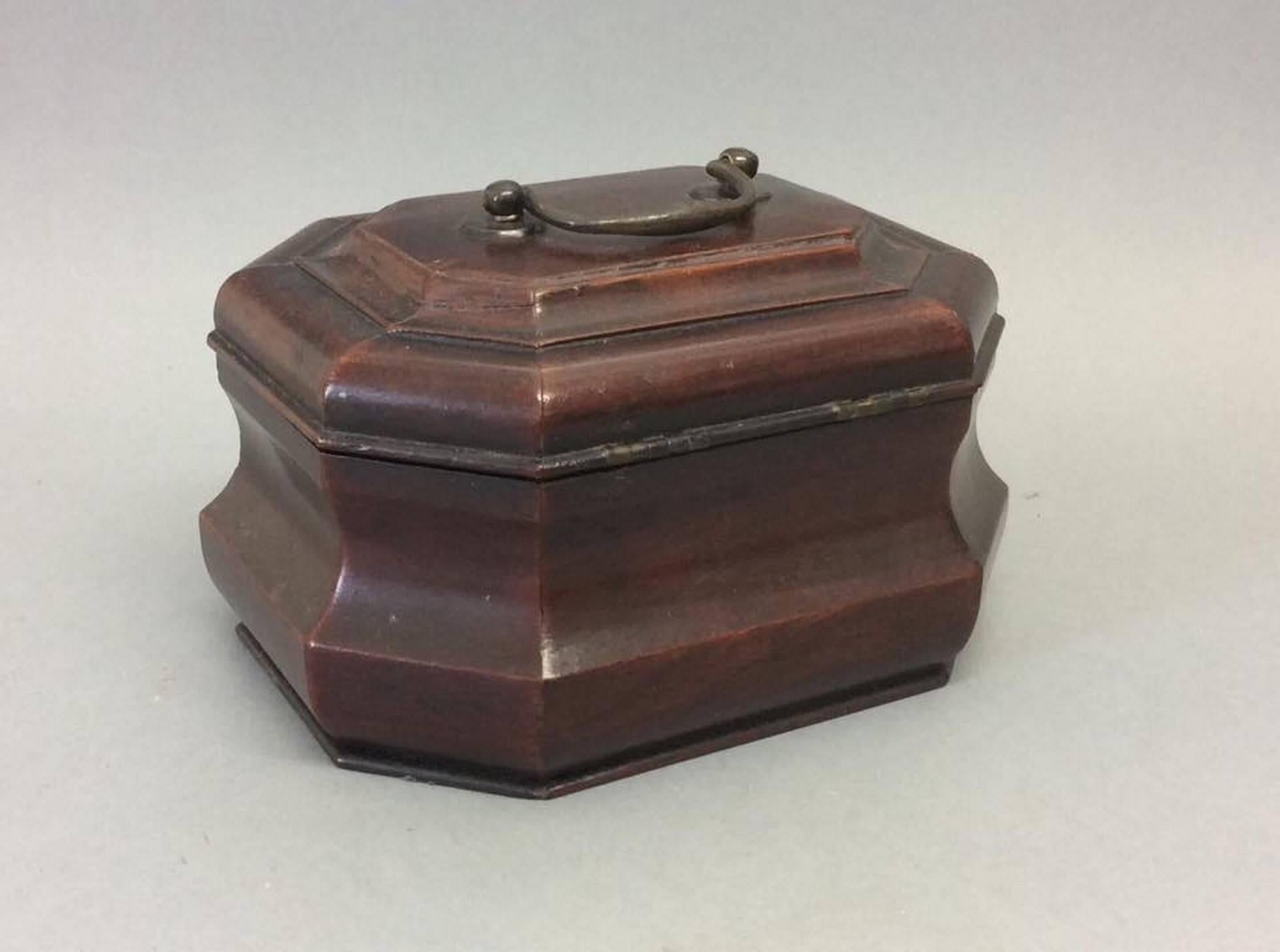 A very rare George III period mahogany tobacco box, the interior retaining a silver metalized lining with a replacement lid, retaining original escutcheon and handle.