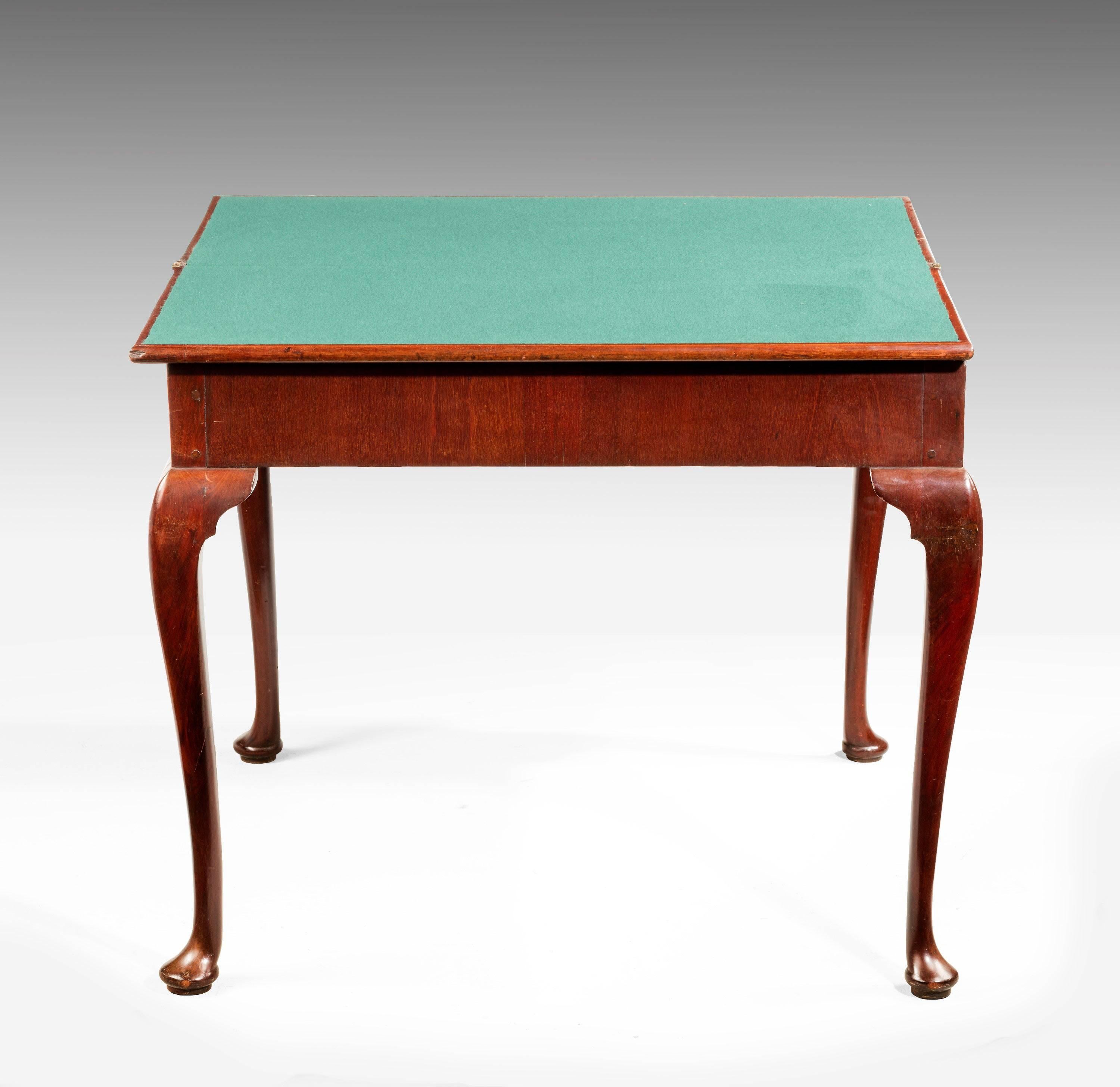 A Chippendale period mahogany card table with finely carved knees to the cabriole supports ending in a flattened bun foot. Very good figuring overall.

RR.