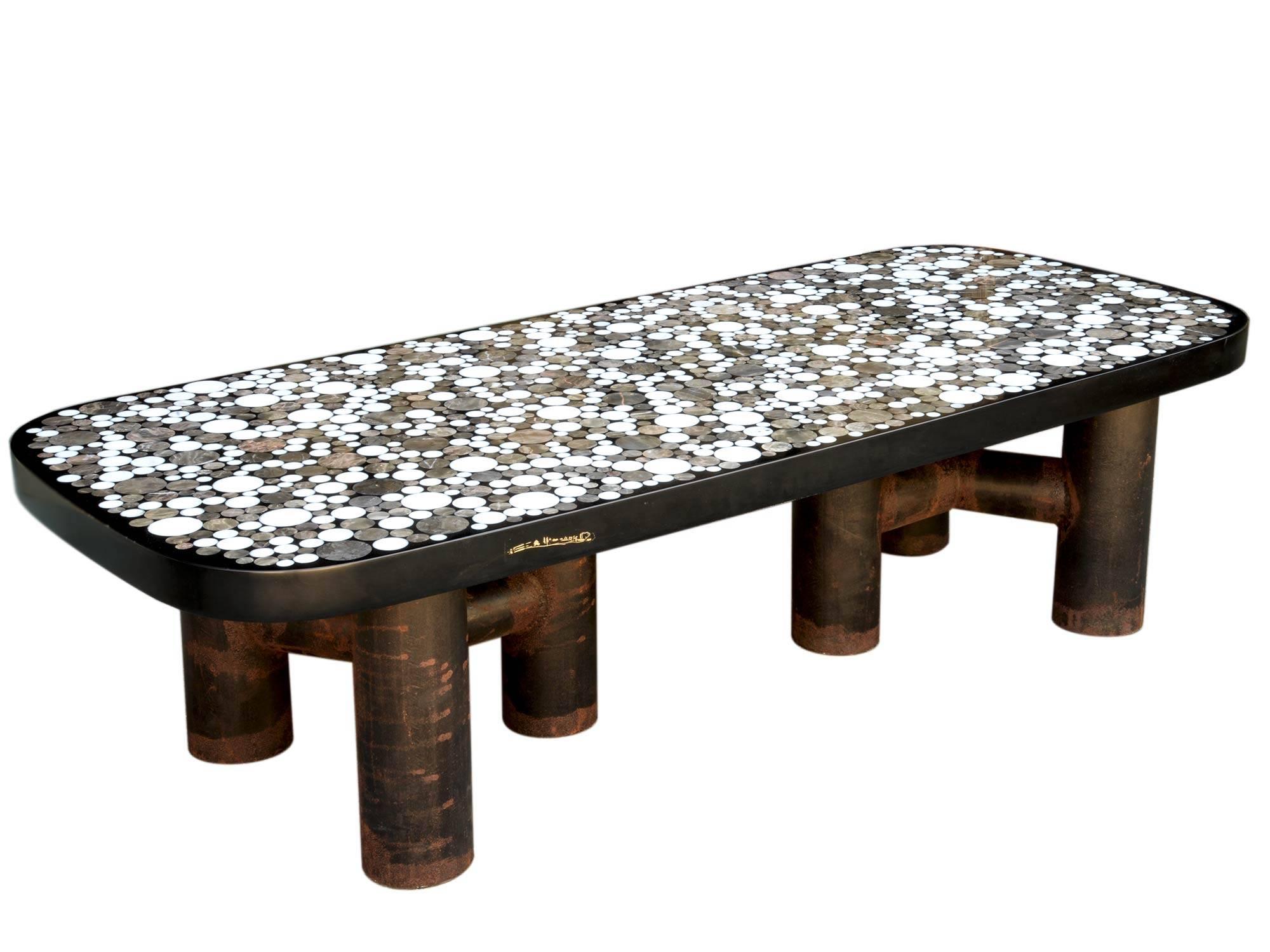 Etienne Allemeersch (1926-2002)
Coffee table
Marble marquetry included in resin with two tripod feet
Belgium, circa 1970
Measure: H 35 x W 133 x D 57 cm
H 13 3/4 x W 52 3/8 x D 22 1/2 inch.
 