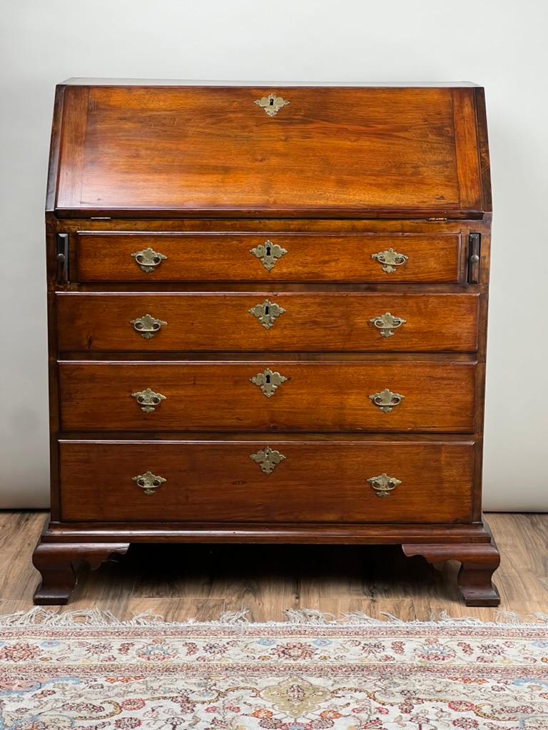 The Chippendale Mahogany Secretary, a late 18th-century gem hailing from Rhode Island or Southern Connecticut, embodies the distinct elegance and intricate craftsmanship of the era. This piece showcases the traditional design hallmarks of the