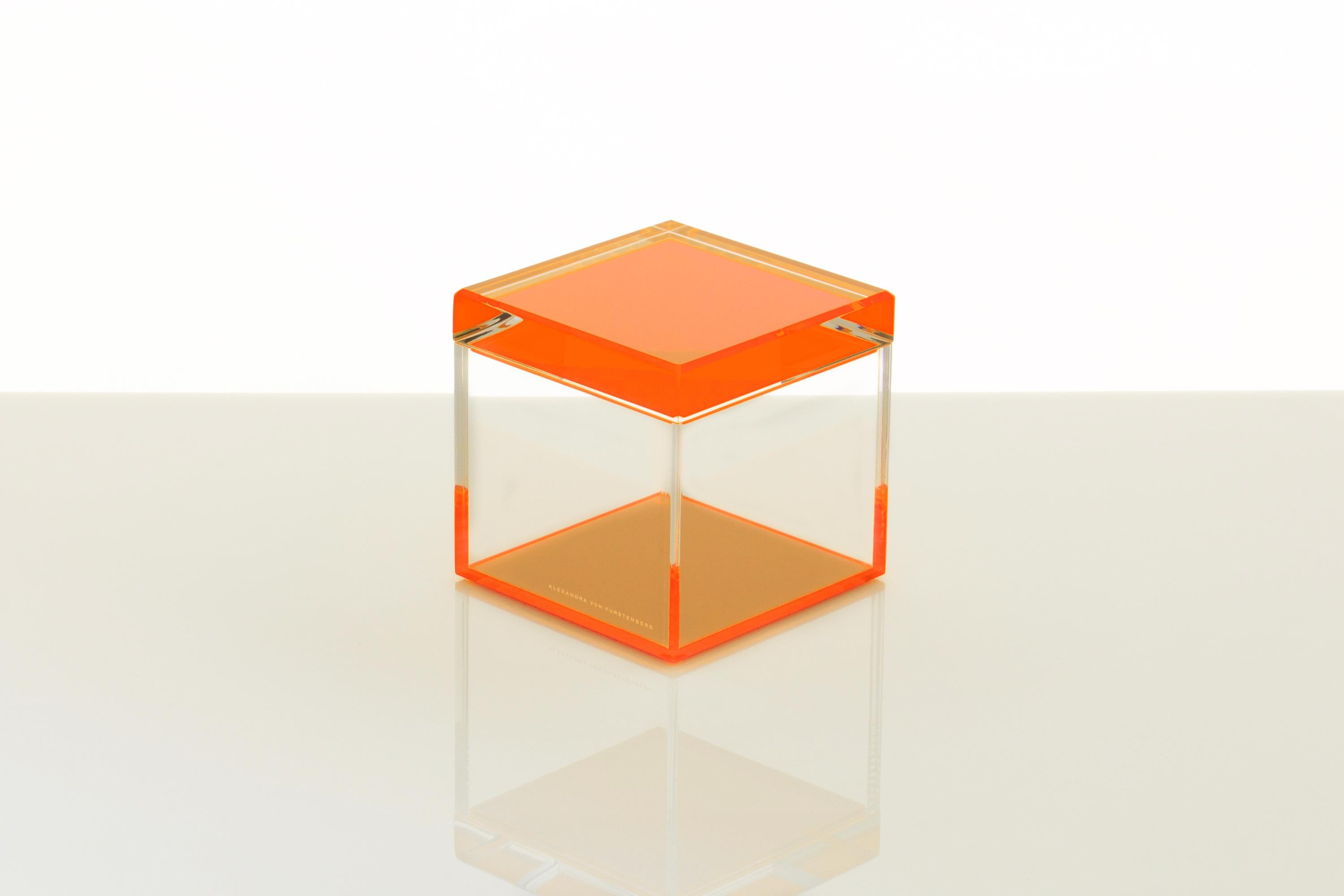 The Cubic Treasure Box in Orange by Alexandra Von Furstenberg a striking fusion of modern design and functional elegance. Crafted from premium acrylic, this 5