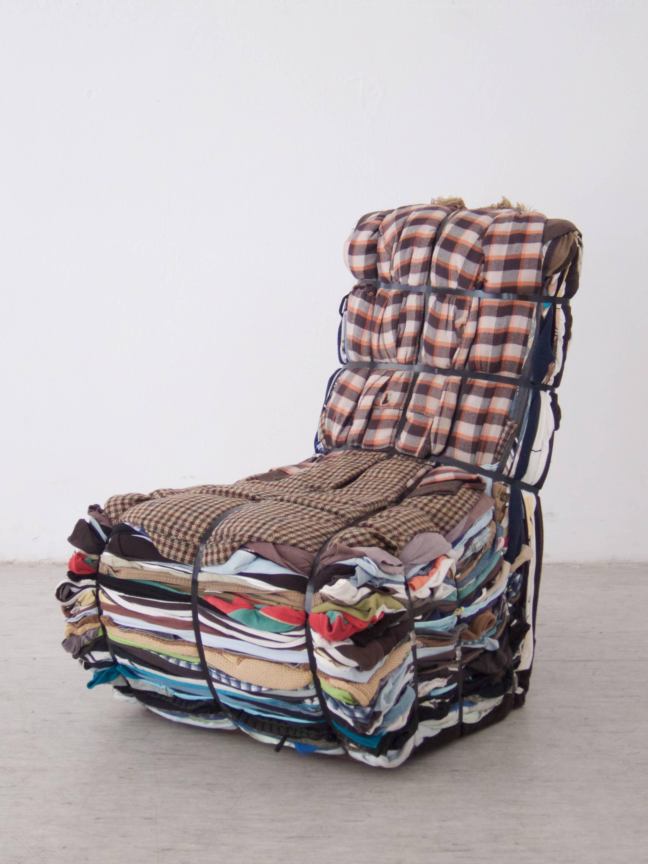 Rag chair 1991 by Tejo Remy for Droog
Made of around 50 kg rags strapped with blue steel packing straps.

Unique piece!
