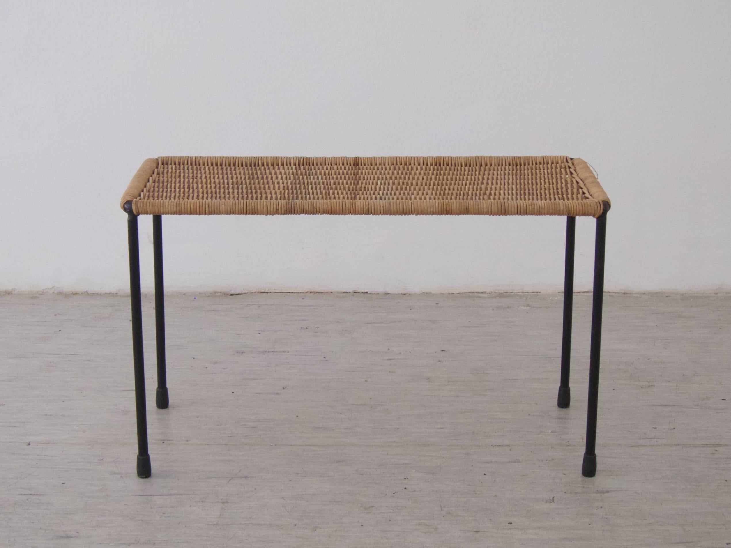Side table by Carl Aubo¨ck
with original wicker top,
black painted steel frame.