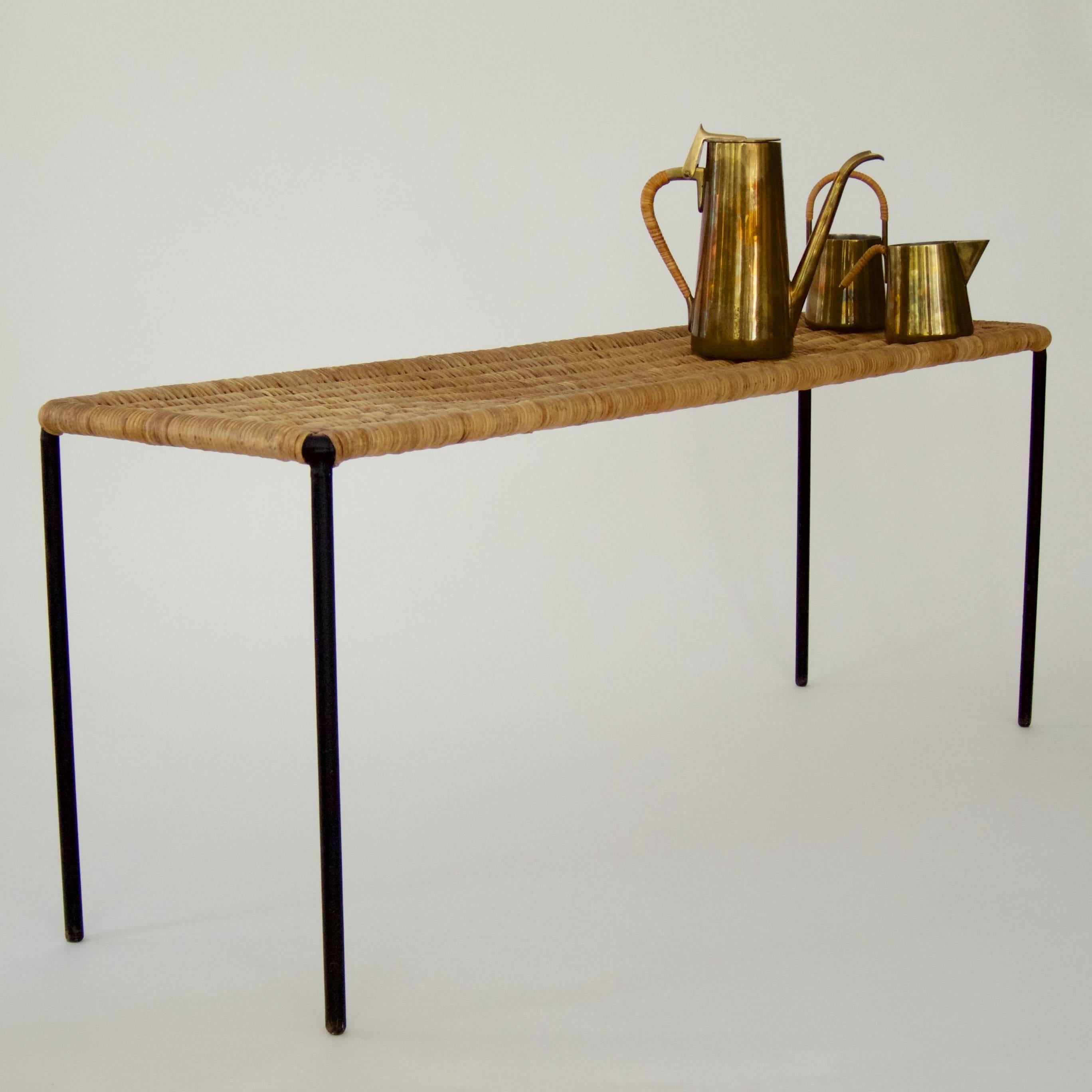 Side table by Carl Auböck
with original wicker top,
black painted steel frame.
