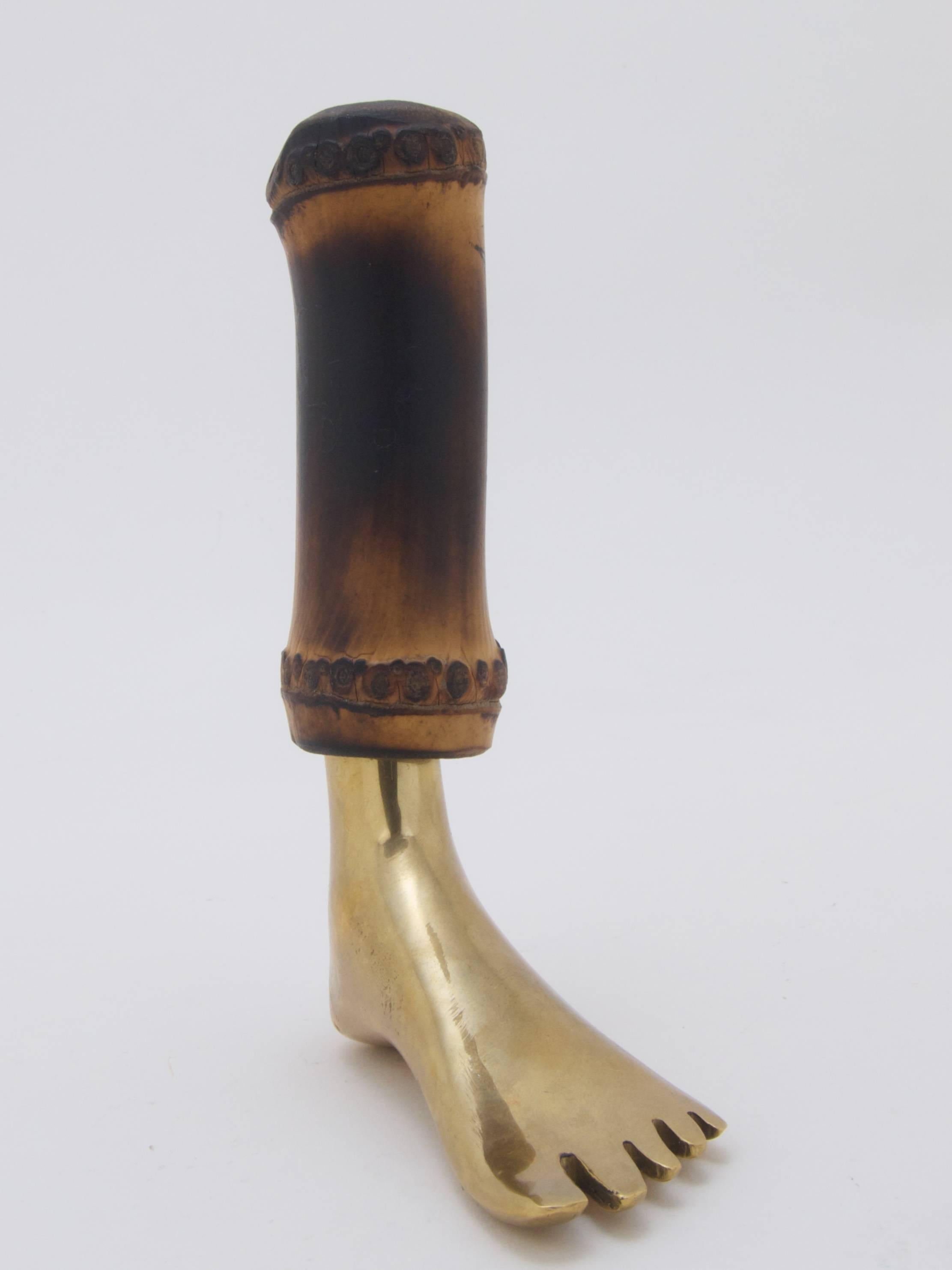 Corkscrew by Carl Auböck
brass foot with a bamboo part to cover the steel spindle
marked with the Auböck logo.