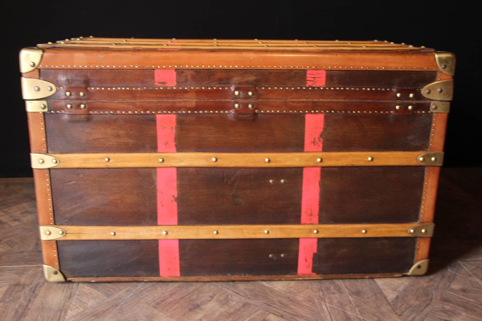 This beautiful Moynat steamer trunk features canvas, brass corners, studs and locks and large leather side handles. It has got a very warm patina.
Its interior has been perfectly relined by a professional and is extra clean so that it could be used