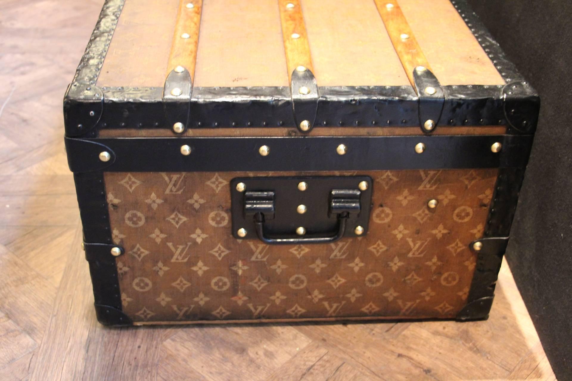 Very pretty little Louis Vuitton steamer trunk featuring steel trim clasps and side handles, brass lock and studs. It has got a very warm patina.
Very rare size, perfect as coffee table or end of bed.
Original interiors.