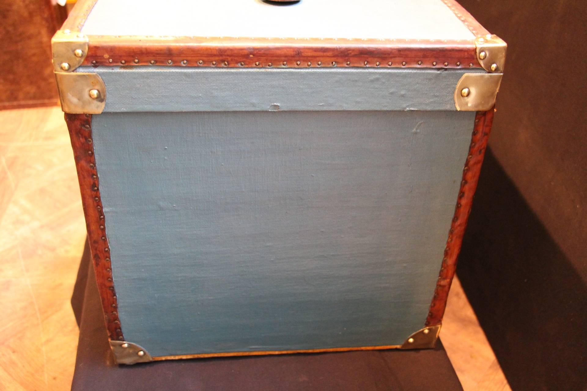 Very nice blue hat box featuring leather trim, brass clasps and corners, leather handle on the top.
Original fresh and clean beige lining interior with its original maker's tag