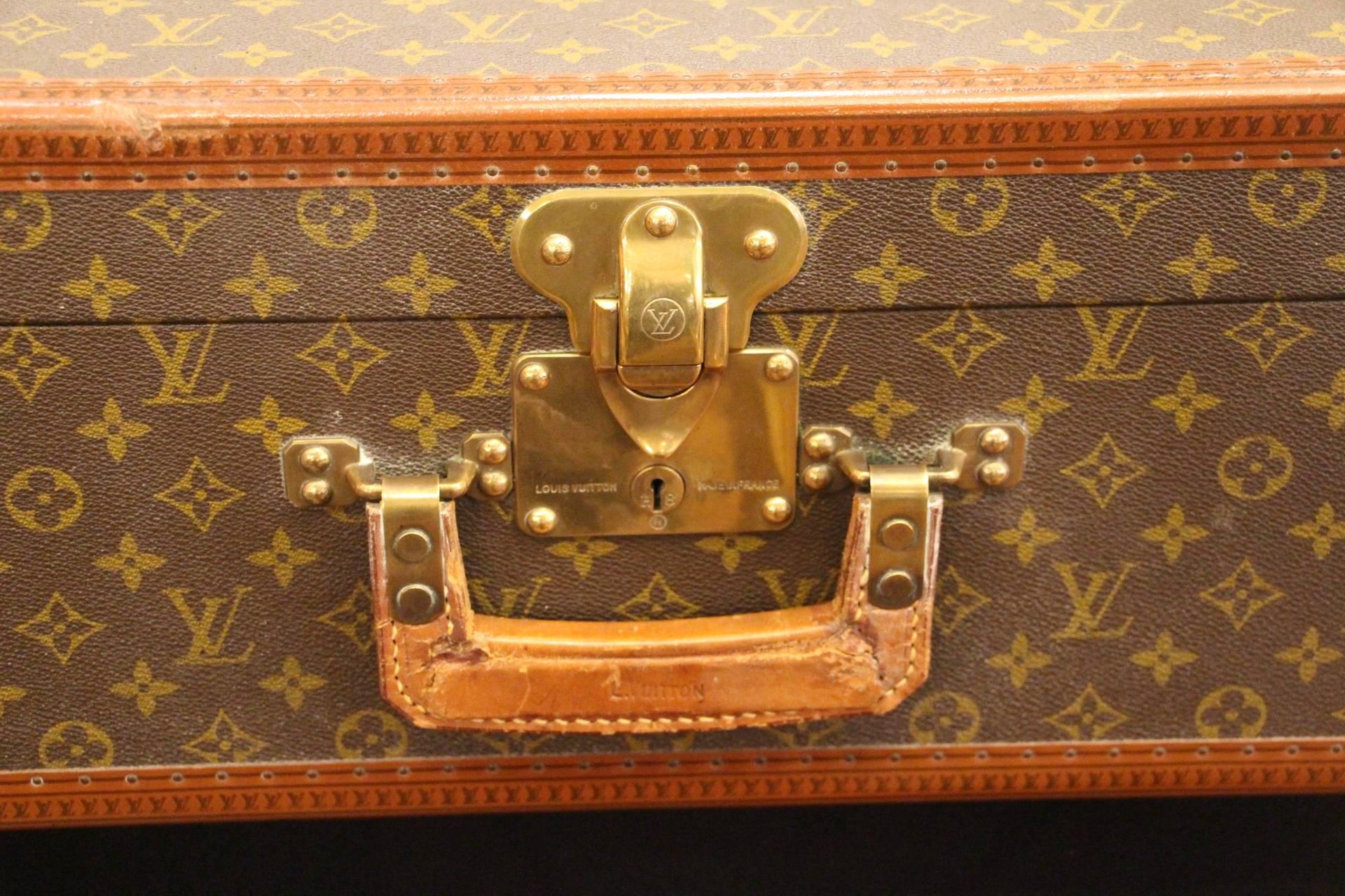 Very nice Louis Vuitton suitcase in monogramm, leather square handle and brass locks and corners. Clean interior.