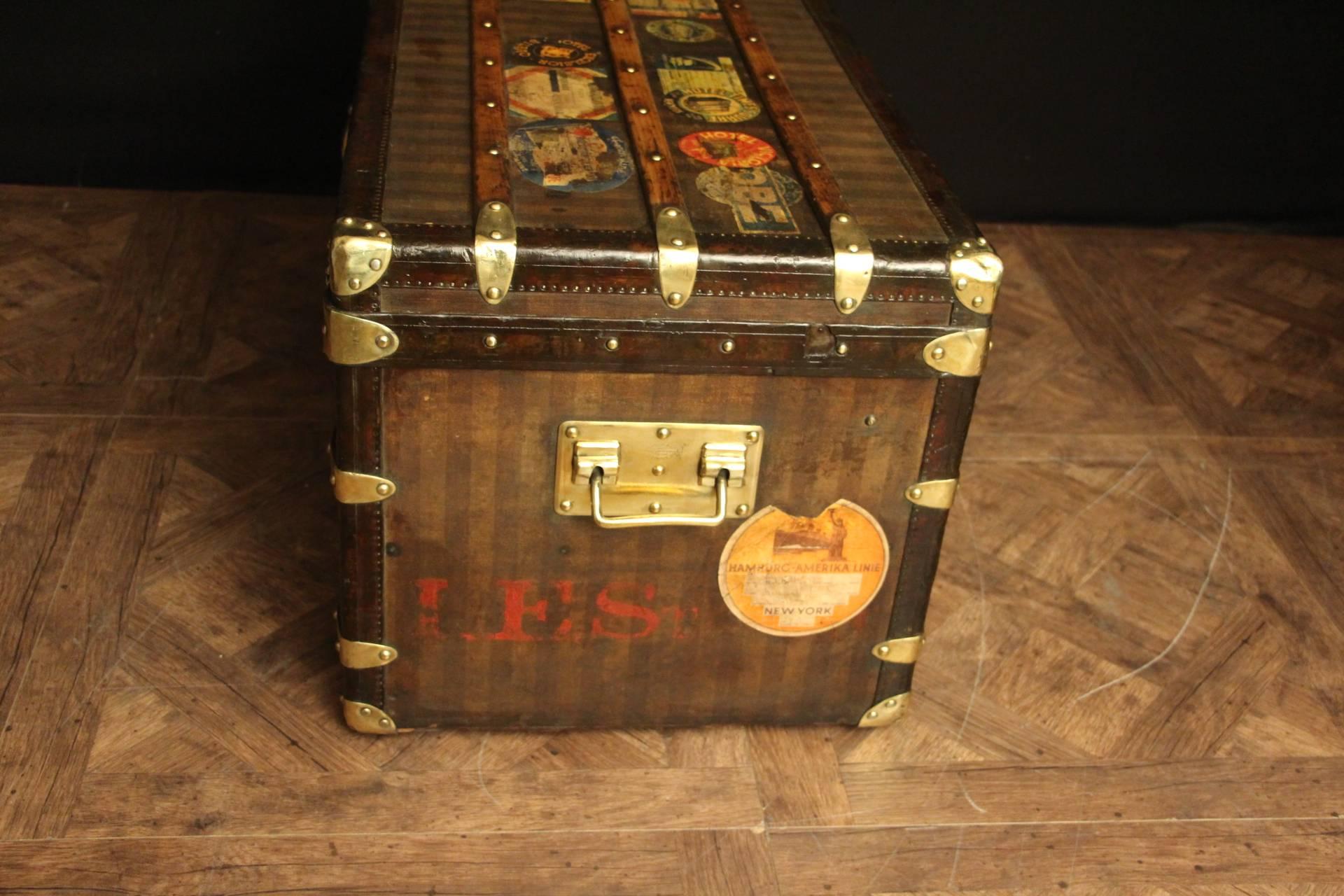 This top of the range luxury striped Louis Vuitton steamer trunk features leather trim, brass locks, corners and side handles as well as LV stamped studs.
It has got a beautiful warm patina and many traveling labels.
Original interior with applied