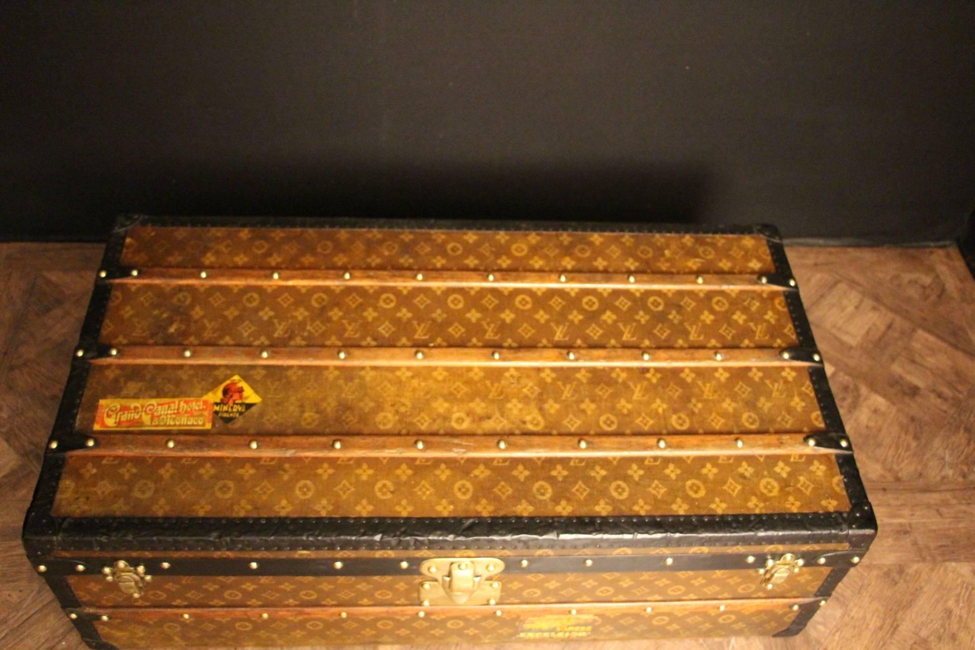 This Louis Vuitton trunk is very unusual because it features tissé canvas. It has got black steel trim, side handles and brass locks. All brass stamped Louis Vuitton studs. It has got very elegant proportions and a very warm patina.
Its interior