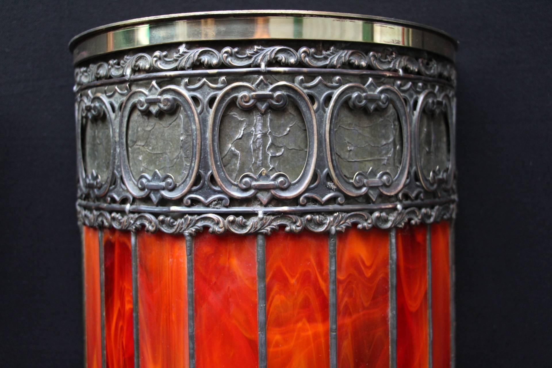 Exceptional pair of opalescent leaded glass wall light with half moon shape. They feature three sculptured copper friezes. They are red when the light is off and become vibrant red to orange when the light is on.
They have a red orange fire aspect.
