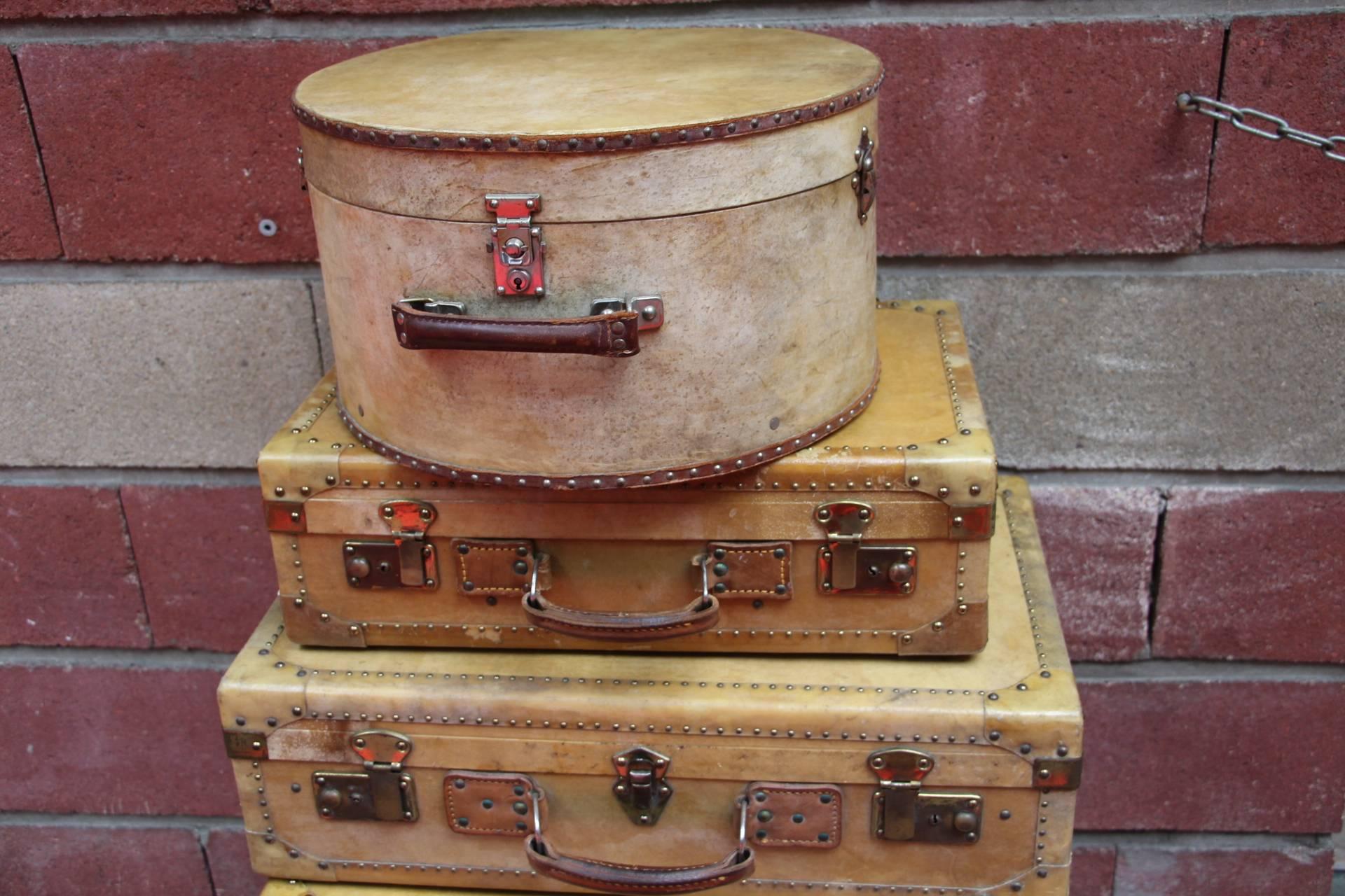 Art Deco Set of Vellum Pieces of Luggage, Five Vellum Suitcases and One Round Hat Box