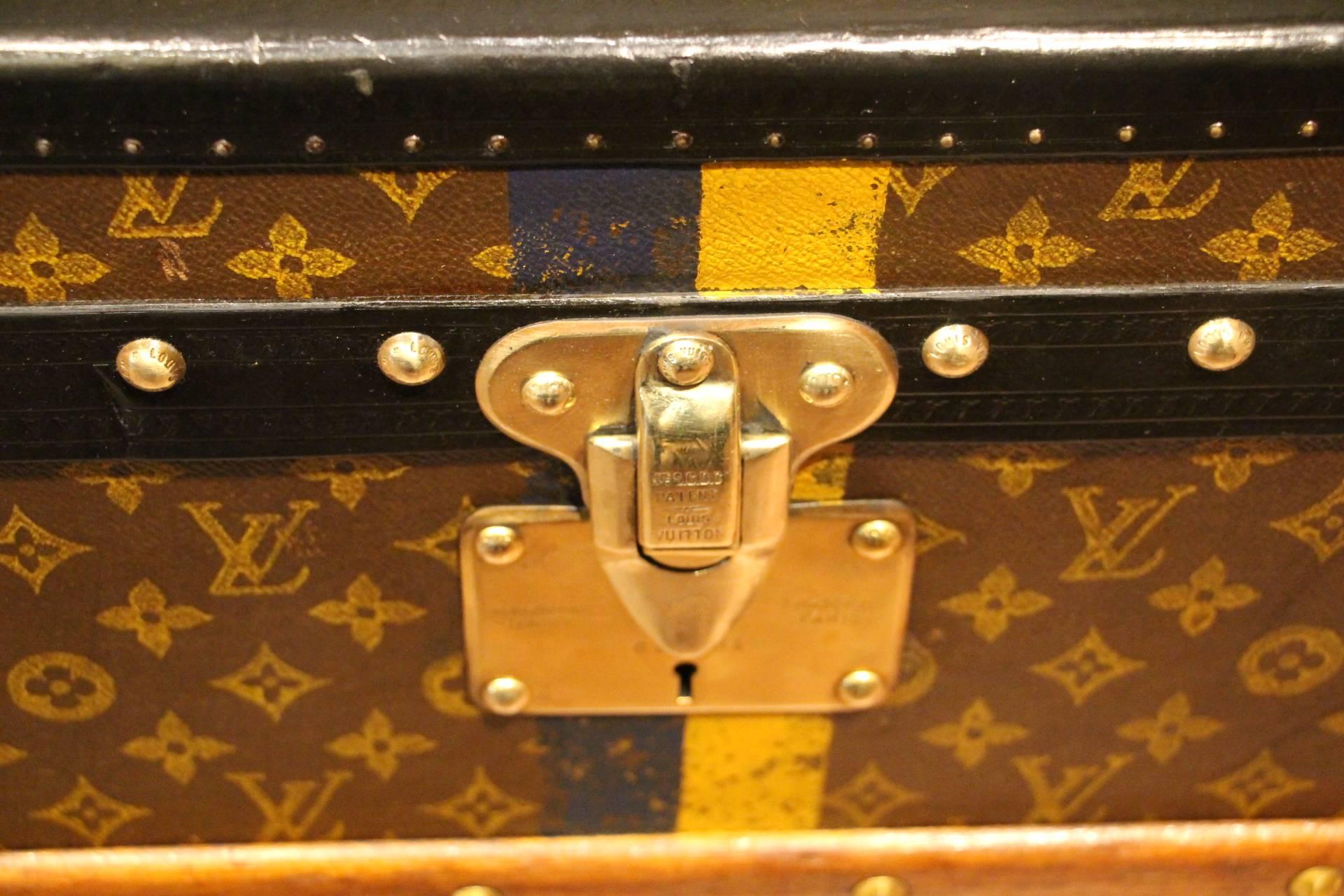 Very nice Louis Vuitton shoe trunk featuring monogram canvas, black lozine trim, brass LV stamped studs and locks and steel side handles.
Beautiful patina and very charming and unusual proportions.
Its interior is all original too in red and beige