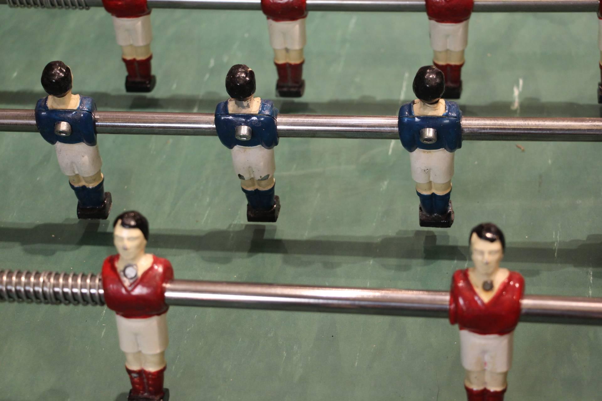 This foosball table is very unusual because it is a very nice mahogany and the players are made of painted aluminium. All polished aluminium fittings. It has got a very design and elegant shape.
Its still has got its original green field.
It is in
