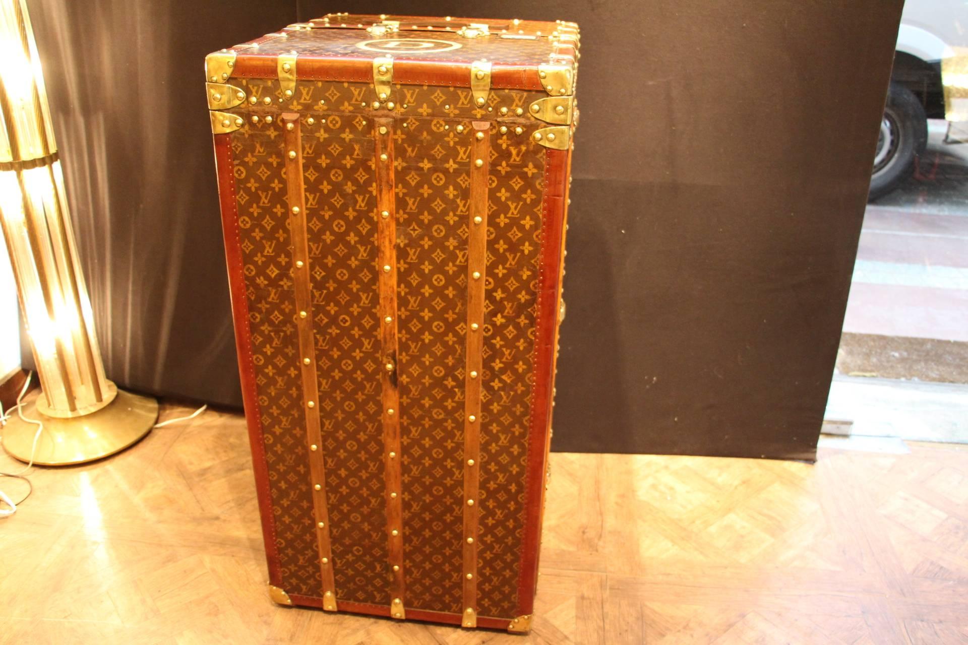 This impressive Louis Vuitton wardrobe features stenciled canvas, lozine trim, LV stamped solid brass locks and studs as well as solid brass corners.

It has got a lift top that closes thanks to two brass locks.

Its interior is remarkable with