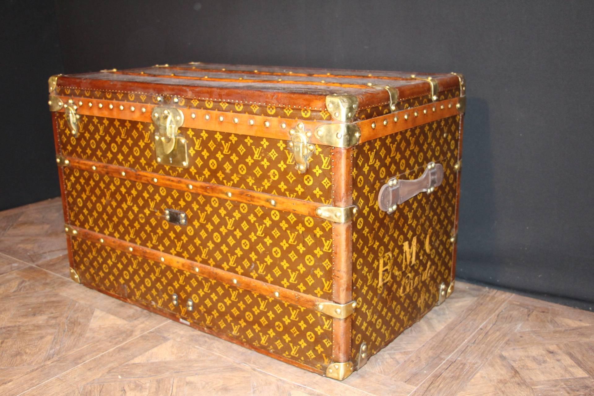 This beautiful Louis Vuitton trunk is all stenciled LV monogram canvas, with all brass hardware and leather trim. It has got a remarkable patina. 
All original beige linen interior with one large removable tray, with compartments.
Its interior is