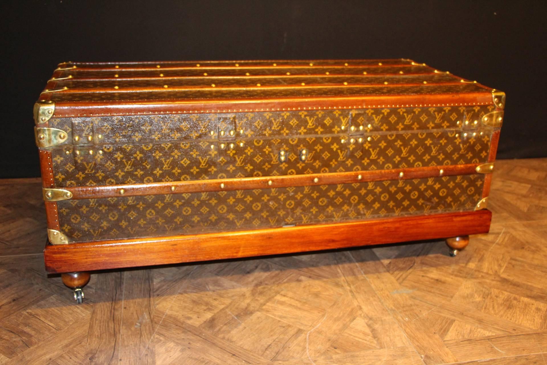 This beautiful Louis Vuitton cabin trunk has stenciled LV monogram canvas, brass fittings and lozine trim.
Inside is all original lining, in good condition.
A wood base has been custom for this trunk that you may use or not.
Its use is to get it