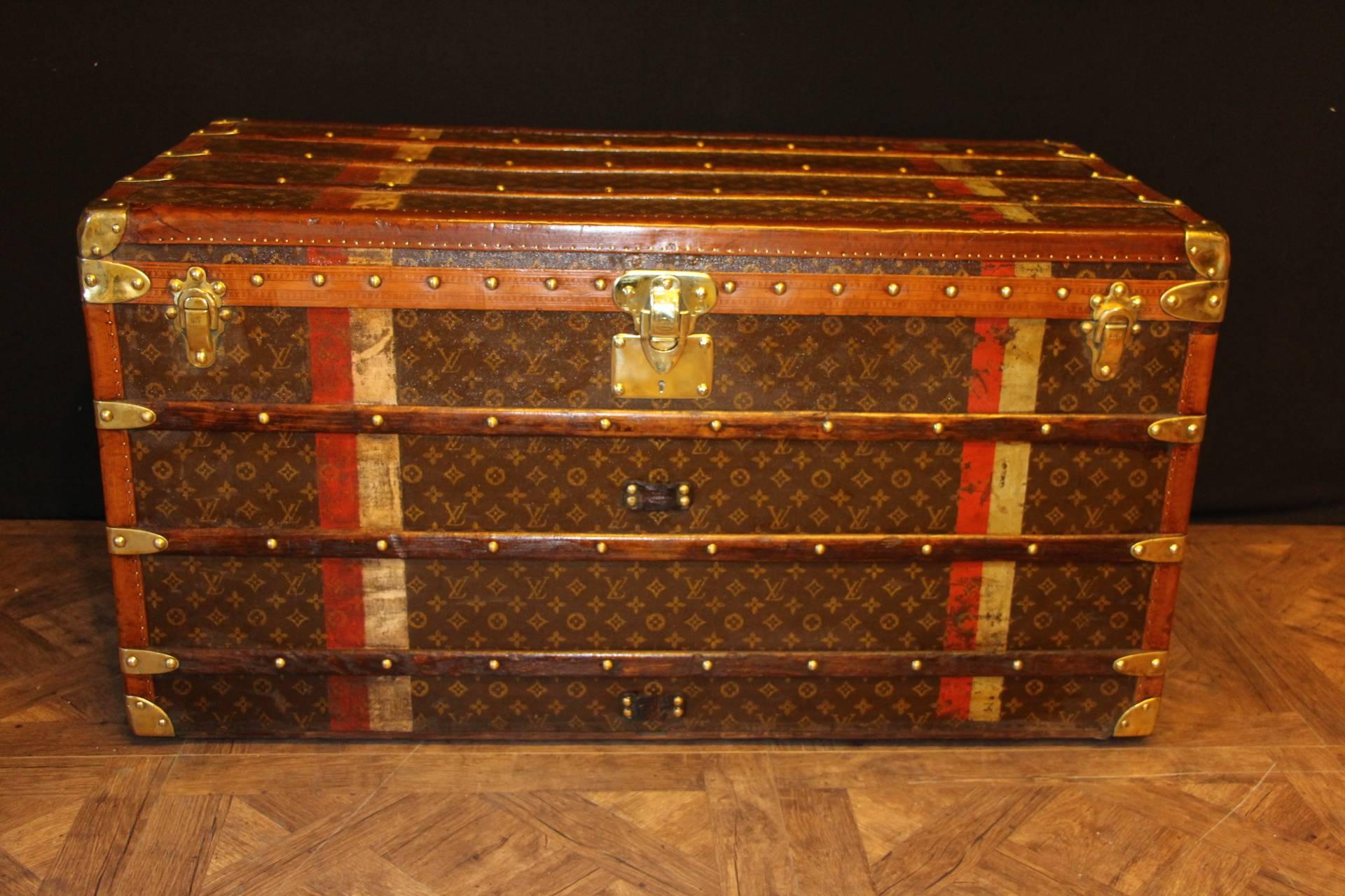 This beautiful Louis Vuitton trunk is all stenciled LV monogram canvas, with all brass hardware and lozine trim. It has got a remarkable patina. Red and white identity stripes.
All original beige linen interior with one large removable tray.
Its