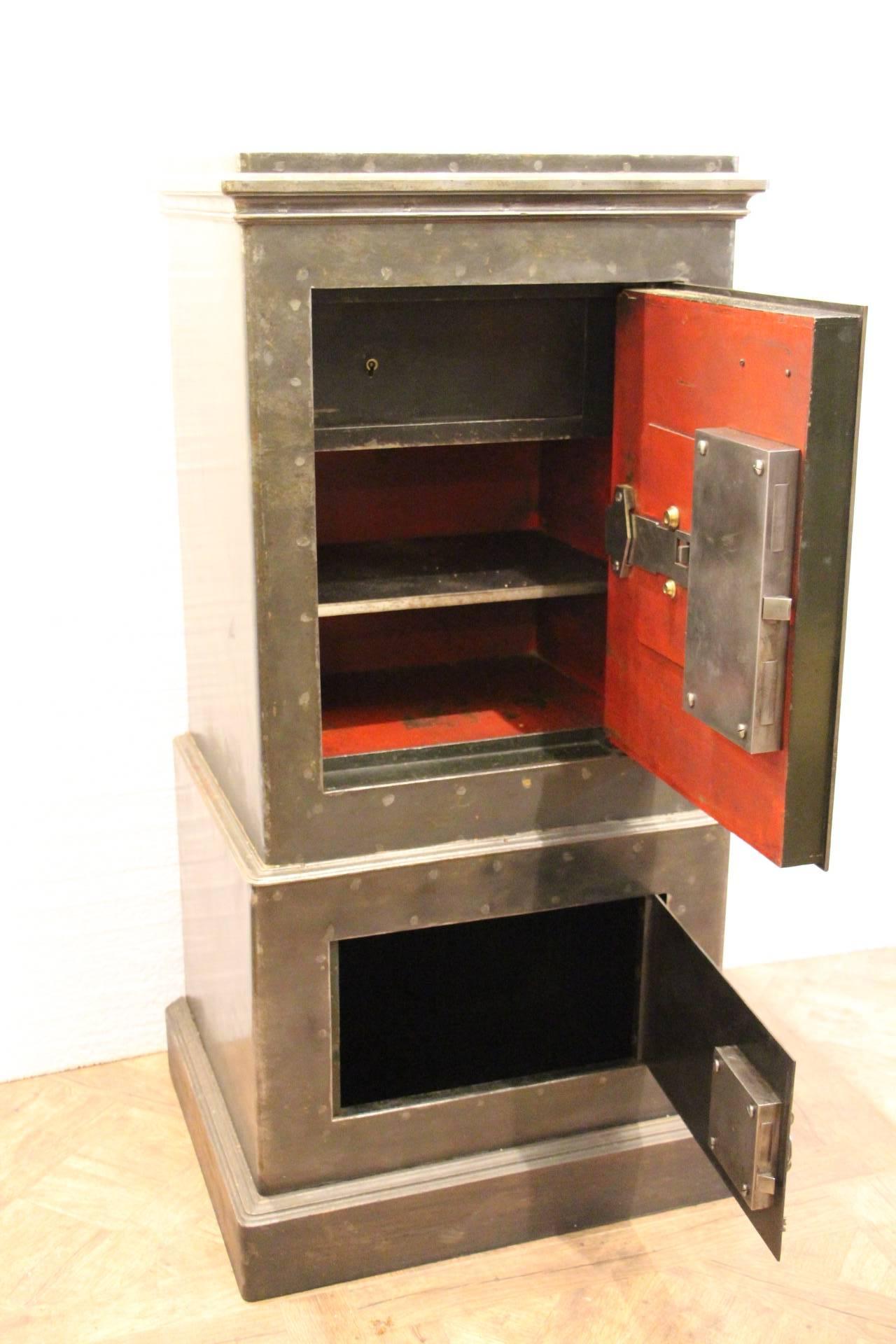 Beautiful French steel and iron safe opening with its keys and its 4 letters' combination. Fully functional. It features two doors, one on the top and another one in its base. 
The top door reveals a very sturdy mechanism closing thanks to an