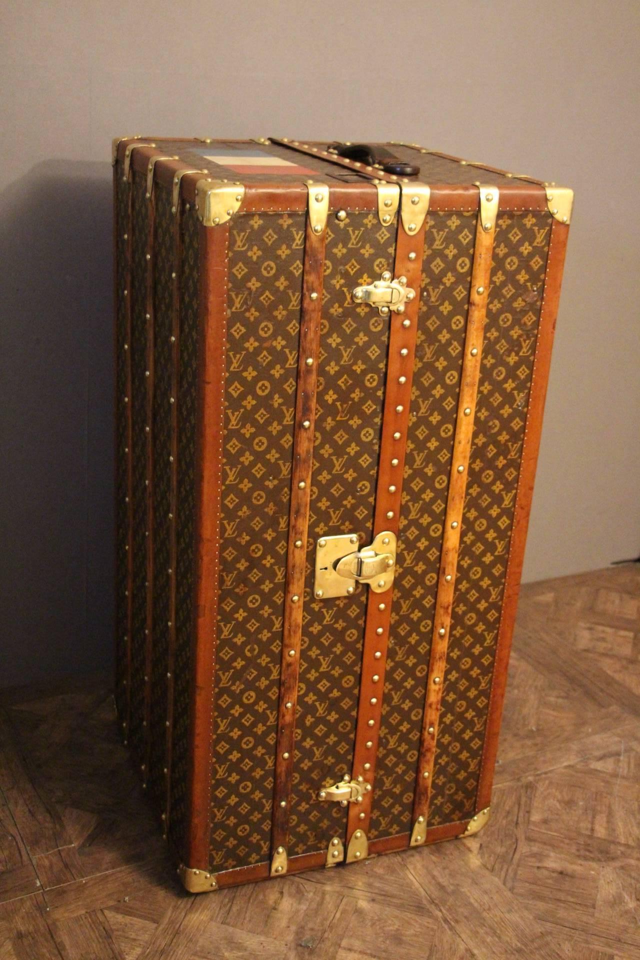 This beautiful wardrobe steamer trunk from Louis Vuitton features stencilled monogram canvas, leather top handle, solid brass locks, corners and all LV stamped studs. Very warm patina.
Very nice interior too with a folding hanger section a shoe