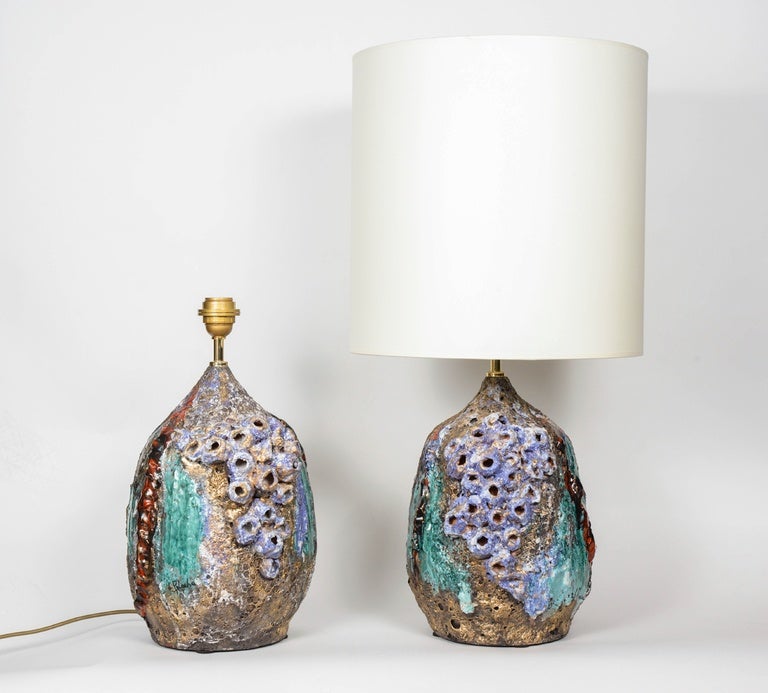 Unique pair of lamps designed and made by the Sardinian artist Emilia Palomba. Each piece is made of textured ceramic and covered with paint.
Both lamps are signed by the artist.