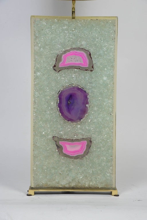 Exquisite pair of lamps made of bronze feet holding a massive white fractale body incrusted with different shades of blue, purple and pink agates.

Glustin Luminaires creation.