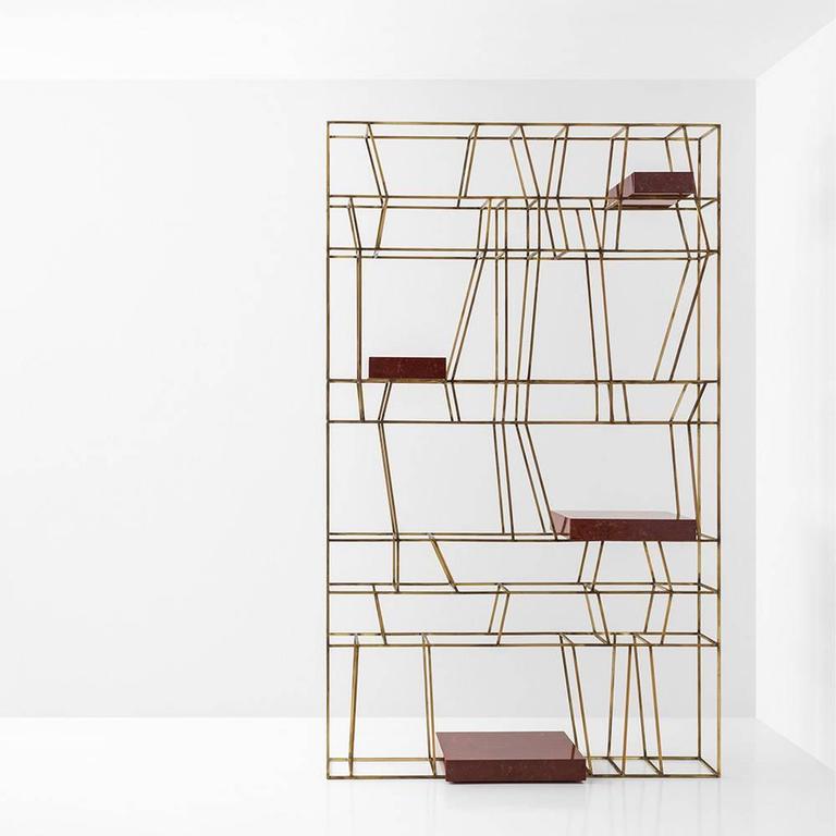Reminiscent of the Fine lines of a postmodern drawing, Dimore Studio’s 2006 shelving system is made in painted metal or oxidized brass. Shelves are available in smokey glass, glass, marble, brass or painted metal.

Dimore Studio’s Progetto Non