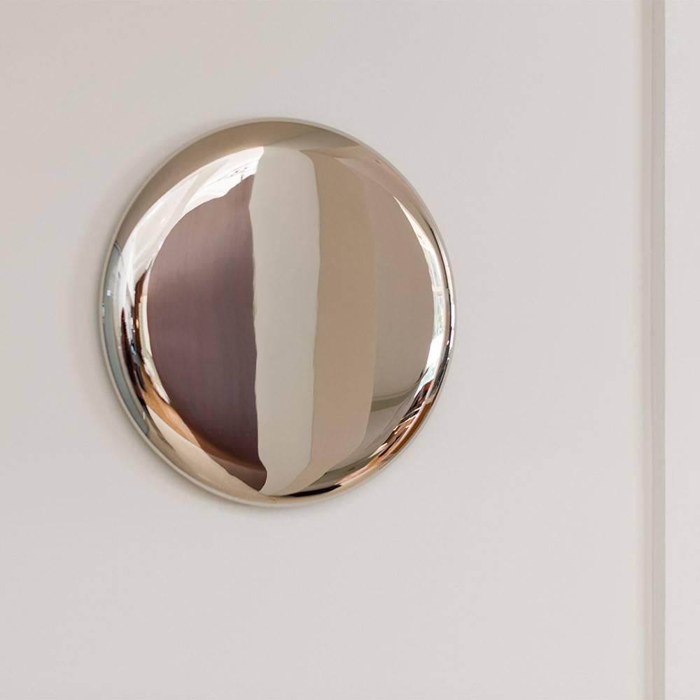 Hand made, these sleek beauty mirrors are crafted using stainless steel and gold plating. 

Michael Anastassiades produces exceptionally designed objects of permanent value, combining fine detailing and honest expression to reinforce the elegance