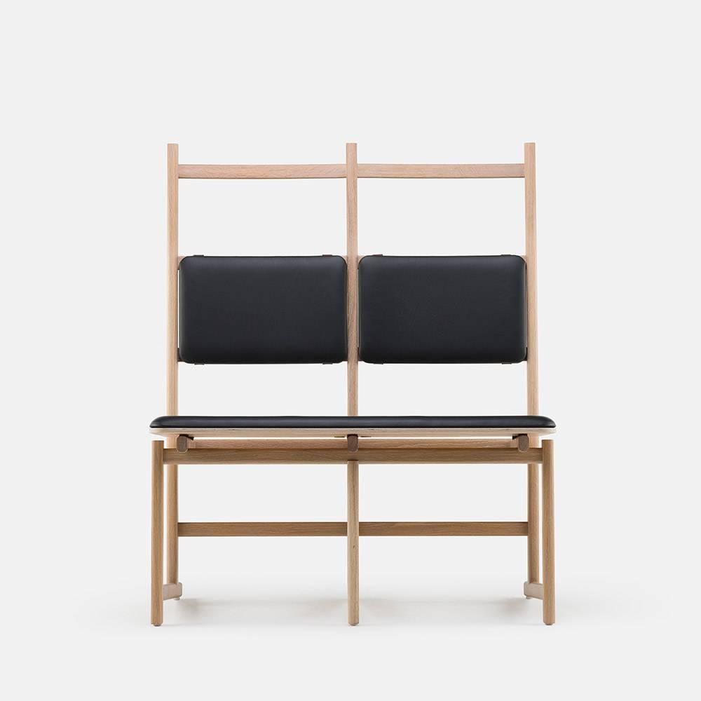 Shaker is a bench inspired by the simple, honest and utilitarian approach of the movement after which it is named. The ladder back allows the chair to be hung on the wall, as the Shakers would have done. The seat is upholstered for extra comfort.