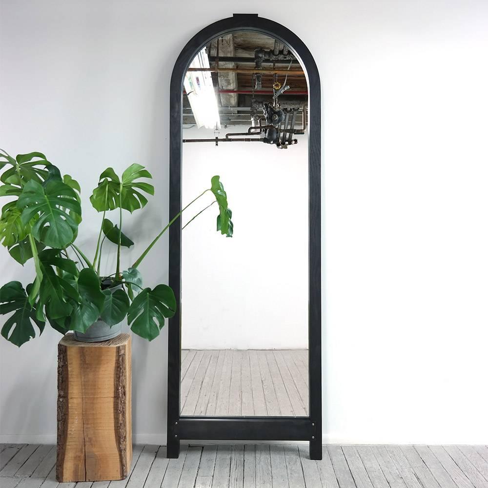 Yucca Stuff’s Brazos mirror is dominated by a strong classical arch, which is formed with solid wood voussoirs. To achieve this effect, the mirror was built like a stone arch, and the protruding keystone hints at the method of construction.

When