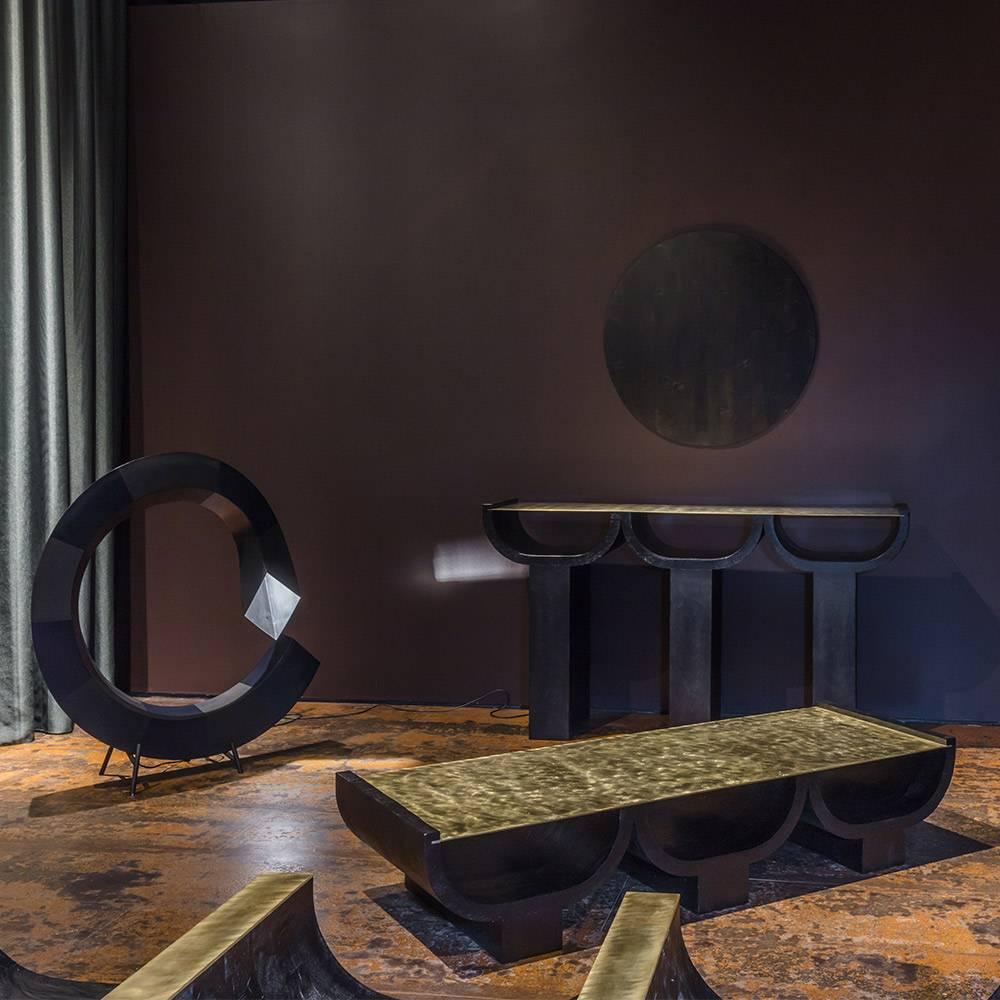 Think of these quixotic pieces as sculpture as much as working lights. The curvilinear shape which features a striped combination of matte and shiny surfaces - was inspired by the notion of the infinite galaxy. While the use of brass and, in the