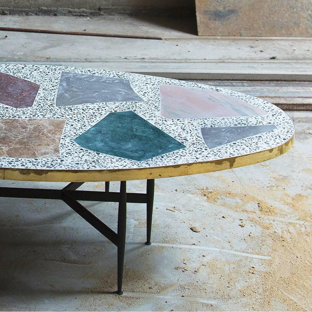 The magic stone coffee table from rooms pairs an almost Primitive-looking stone tabletop with thin steel legs. The interplay between the tabletop – with its elemental mosaic of inlaid stones – against the table’s slim-line Silhouette, gives it the