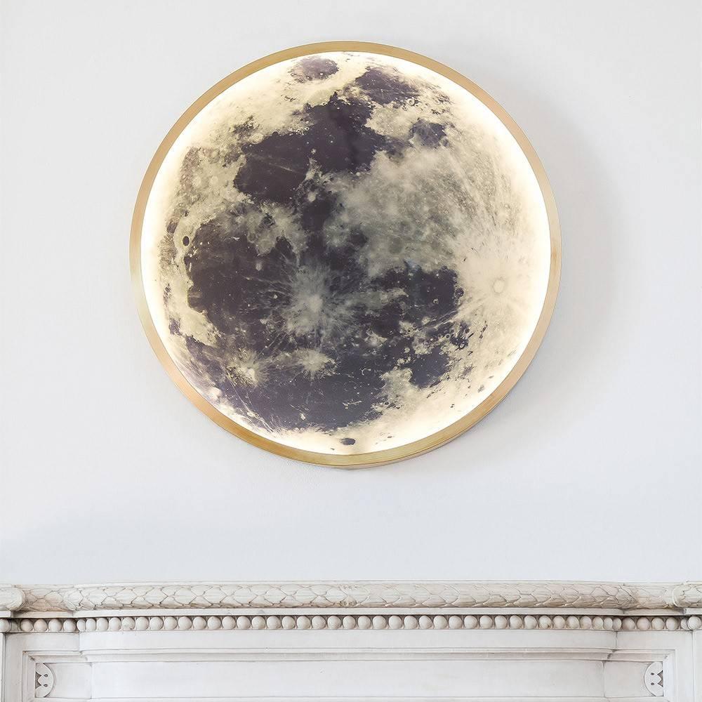 Sculpturally framed in solid bronze or steel, the image of the moon is lit with LEDs from within and enclosed in glass, creating a form that resonates cohesively as light, sculpture and image.

Pictured in brushed brass and steel with black