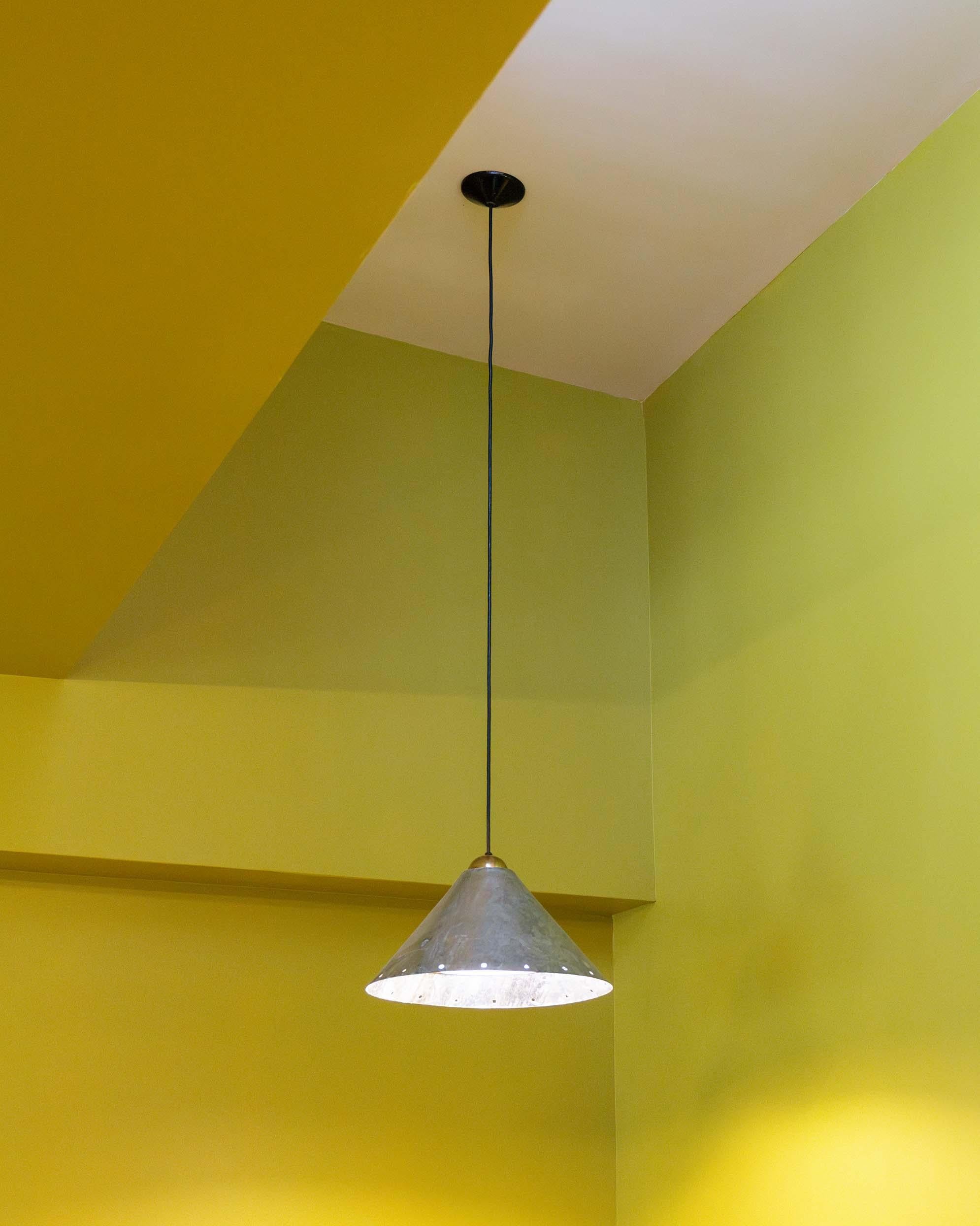 Modernist hanging lamp by Ron Rezek crafted in steel and zinc.