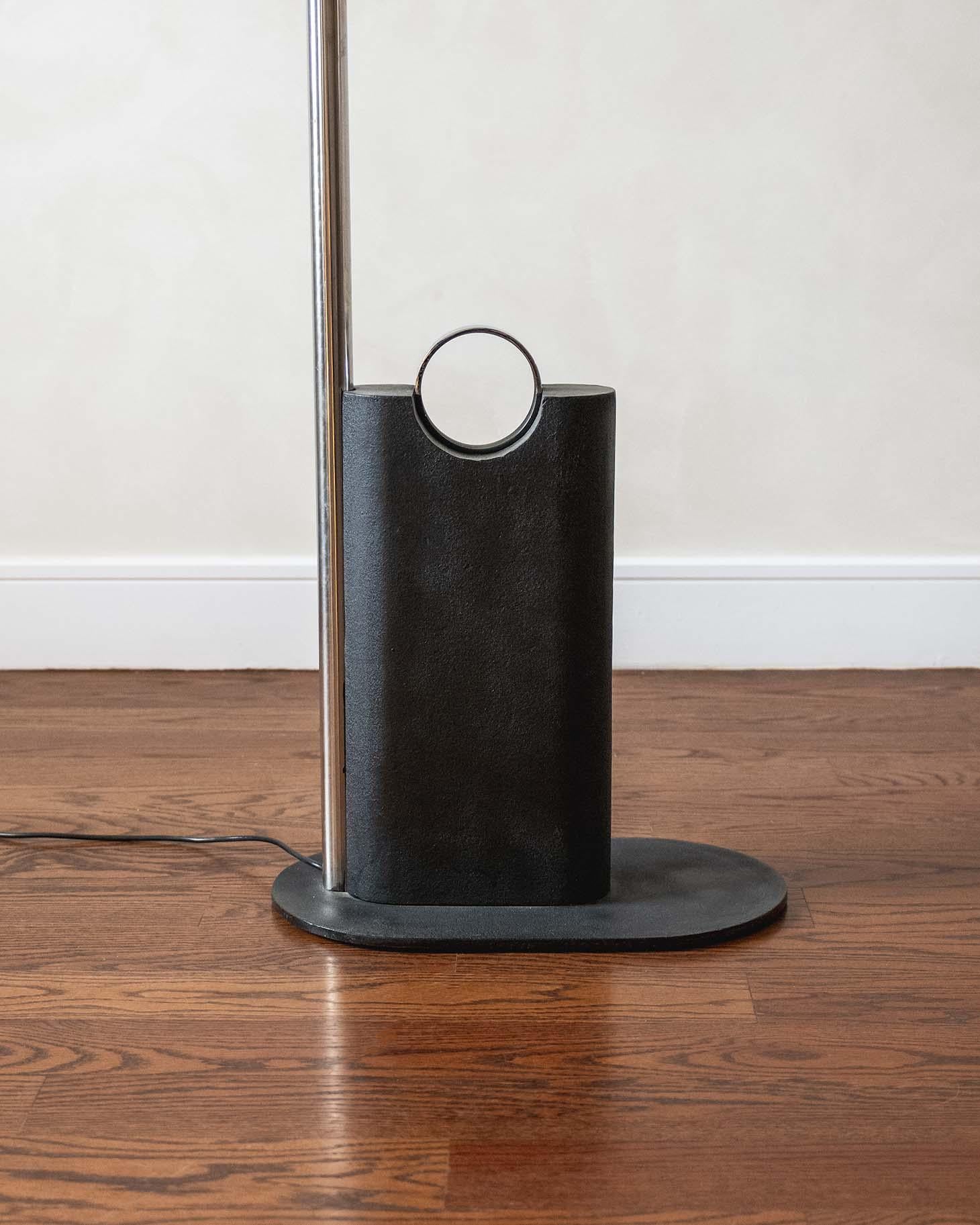 Arc Floor Lamp by Joe Colombo executed with steel and a cast iron base.
(numbered JC002)
