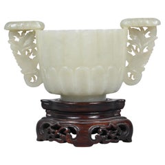White Jade Cup With Carved Handles On A Wooden Base – China, Qing Dynasty, 18th