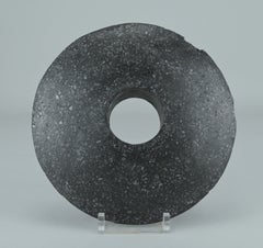 Stone Disc With A Central Hole—possibly A Clubhead From New Guinea