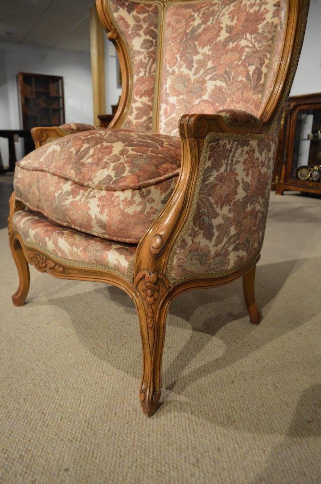 A walnut French antique hooded porters chair. Of traditional 
