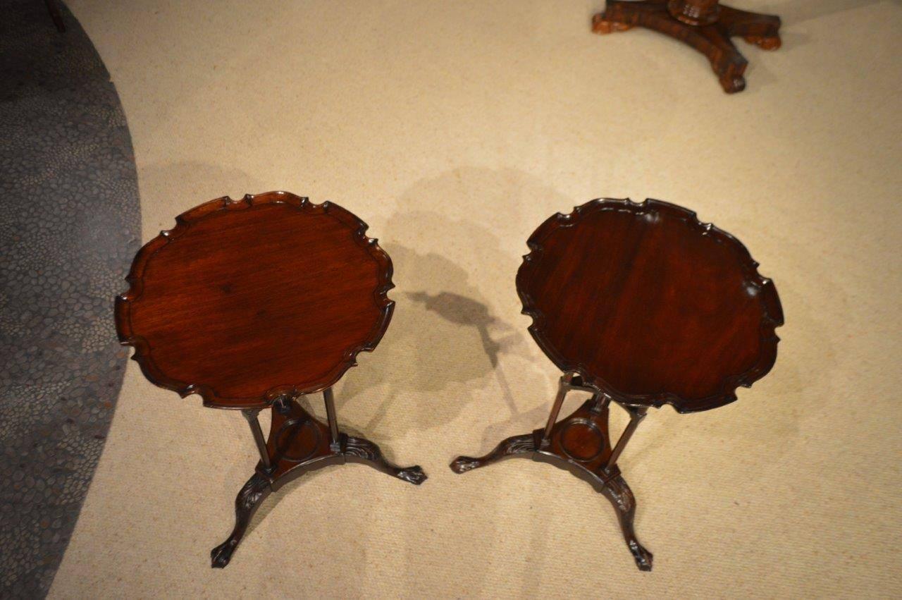 A fine pair of mahogany Edwardian period Chippendale style wine tables. Each with a solid mahogany top with 