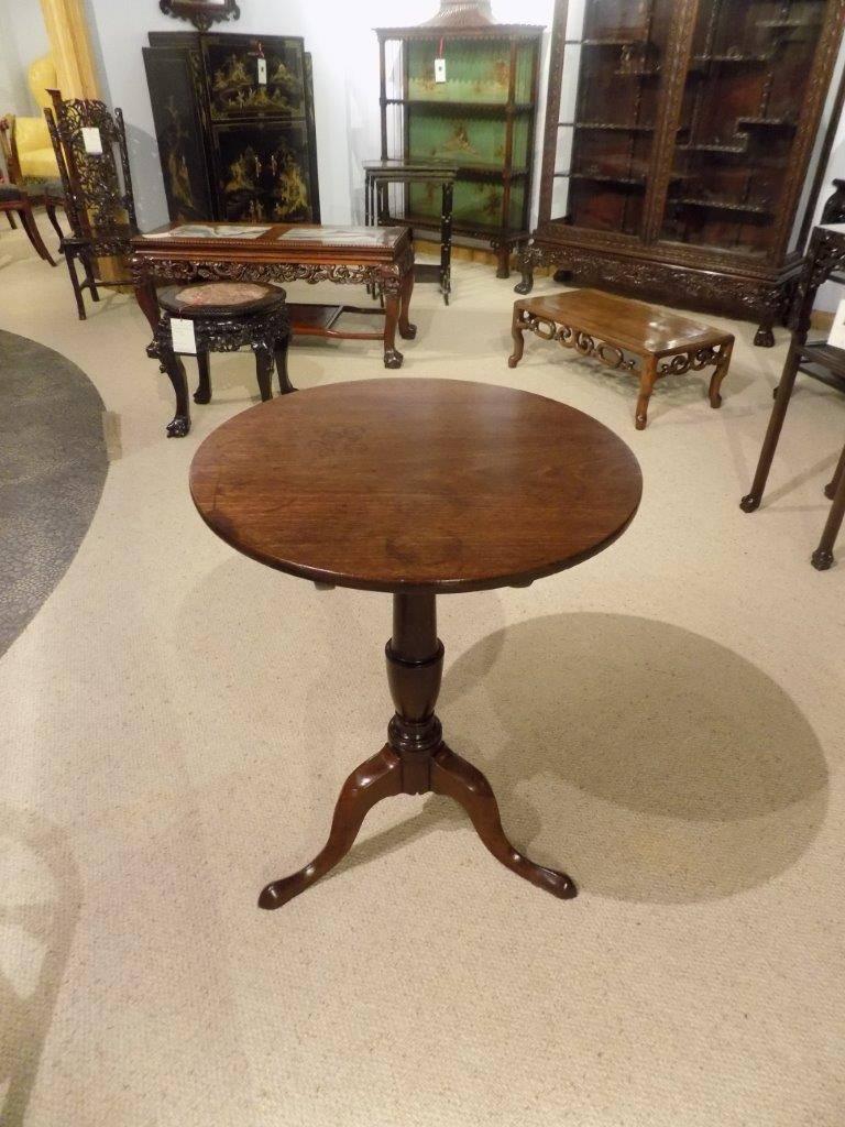 A good mahogany George III period tripod table. The circular Cuban mahogany tilting top raised on a turned stem with three cabriole supports and pad feet, English, circa 1780

Dimensions: 20.5" diameter x 28" high 
Condition: This table