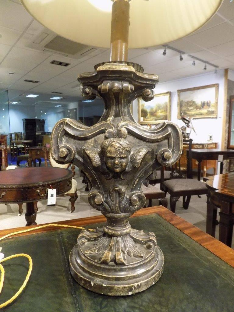 A good pair of antique 19th century Venetian baroque table lamps. Each with a shaped body and carved cherubic figure, supported on a circular pedestal with a silvered finish, Venetian, circa 1880-1900

Dimensions: 34" high with shades x